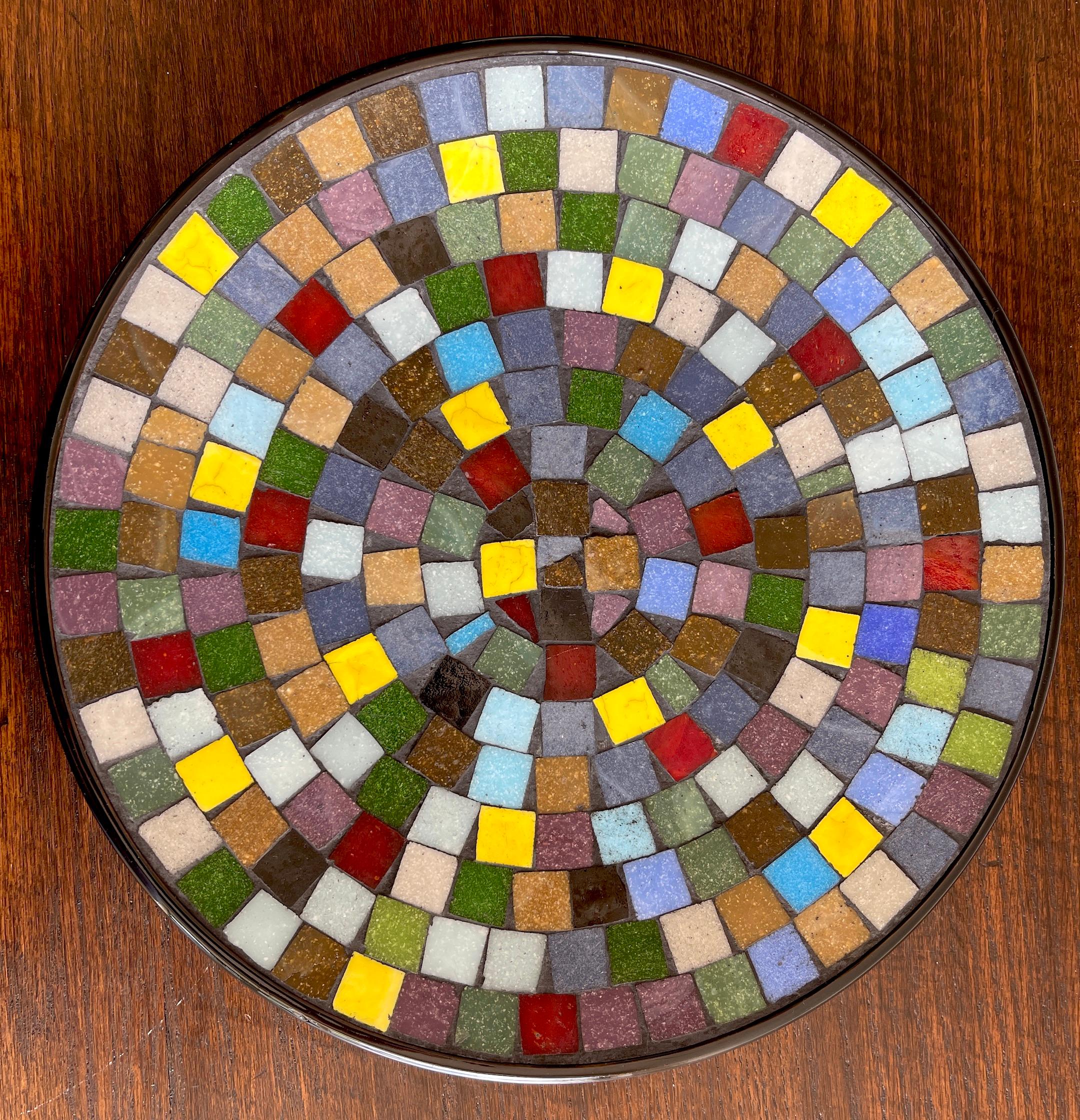 Danish modern colorful Mosaic Vide-Poche or Charger, a unique circular mosaic dish with numerous inlaid colorful porcelain tiles, stamped 'Made in Denmark'.

