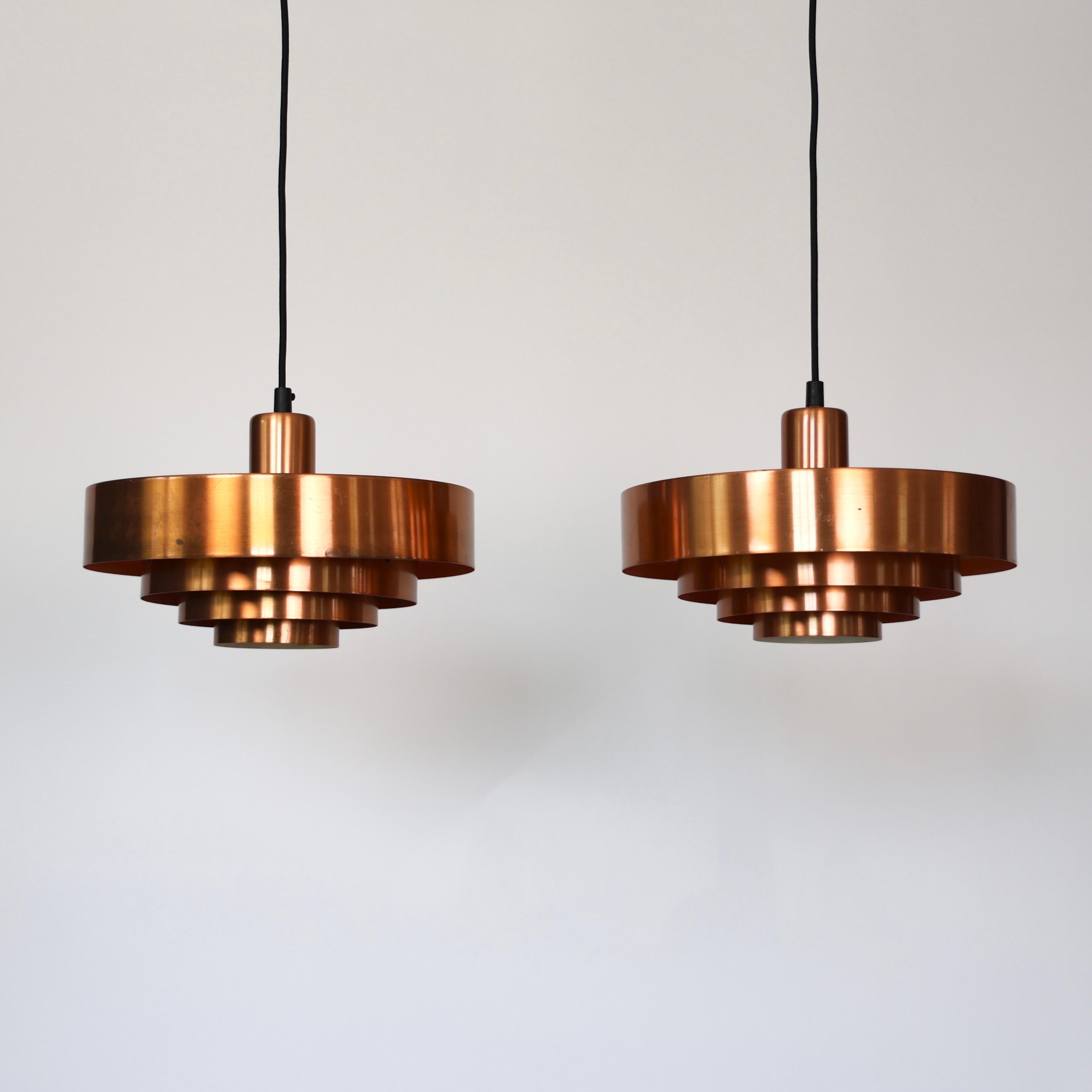 Set of Roulette Copper Pendant lights designed by Jo Hammerborg for Fog & Mørup in the 1960s.

* Set (2) of copper lacquered pendant lights. Orange / white on the inside
* Designer: Jo Hammerborg
* Model: Roulette
* Producer: Fog & Mørup Denmark
*