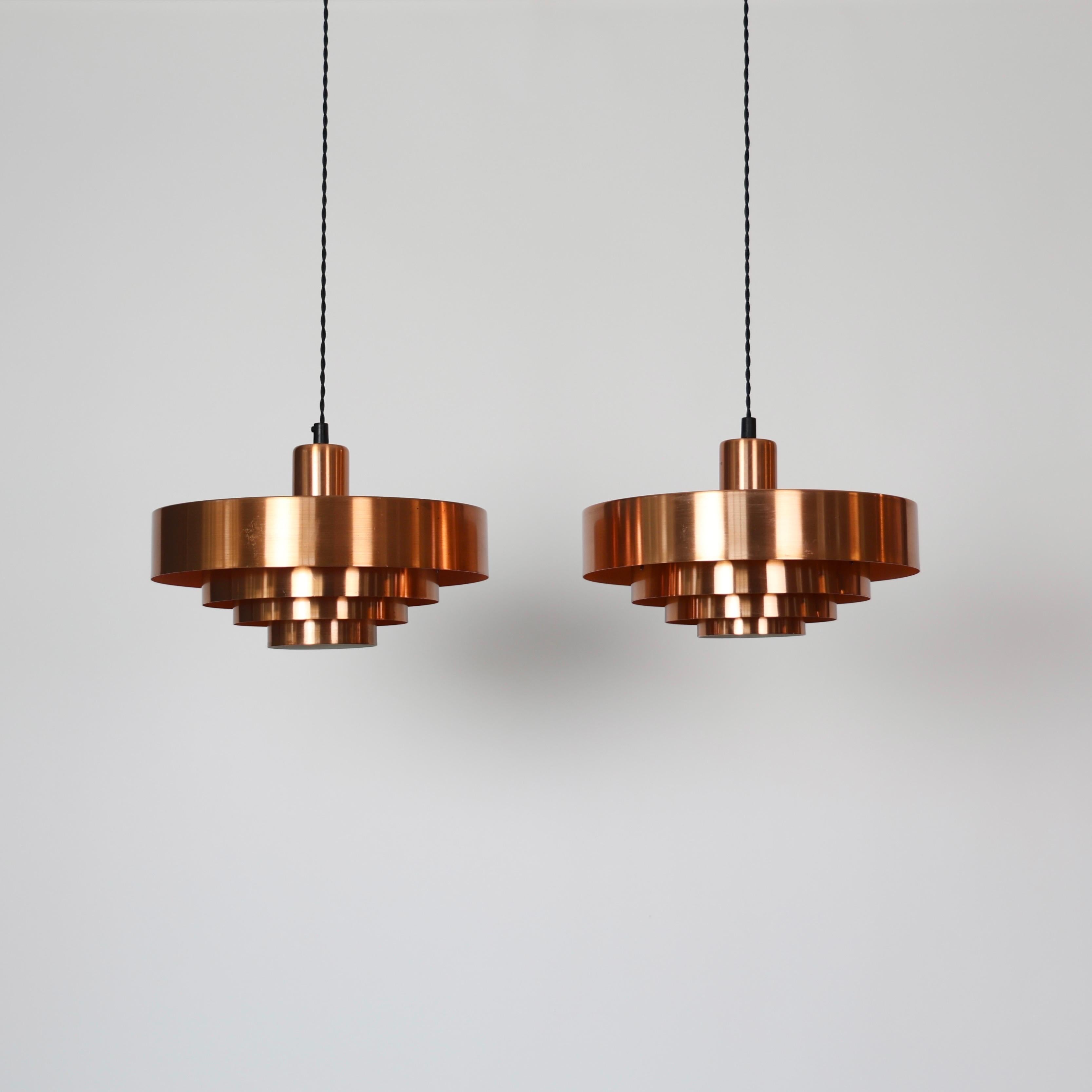 Set of Roulette Copper Pendant lights designed by Jo Hammerborg for Fog & Mørup in the 1960s.

* Set (2) of copper lacquered pendant lights. Orange / white on the inside
* Designer: Jo Hammerborg
* Model: Roulette
* Producer: Fog & Mørup Denmark
*