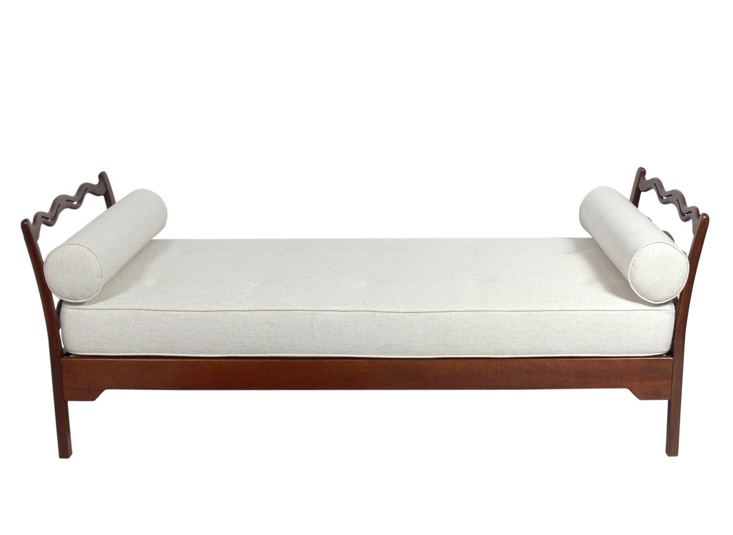 Danish modern daybed, designed by Ole Wanscher for Fritz Hansen,
Denmark, circa 1940s. It has been refinished and reupholstered in an ivory color herringbone fabric.