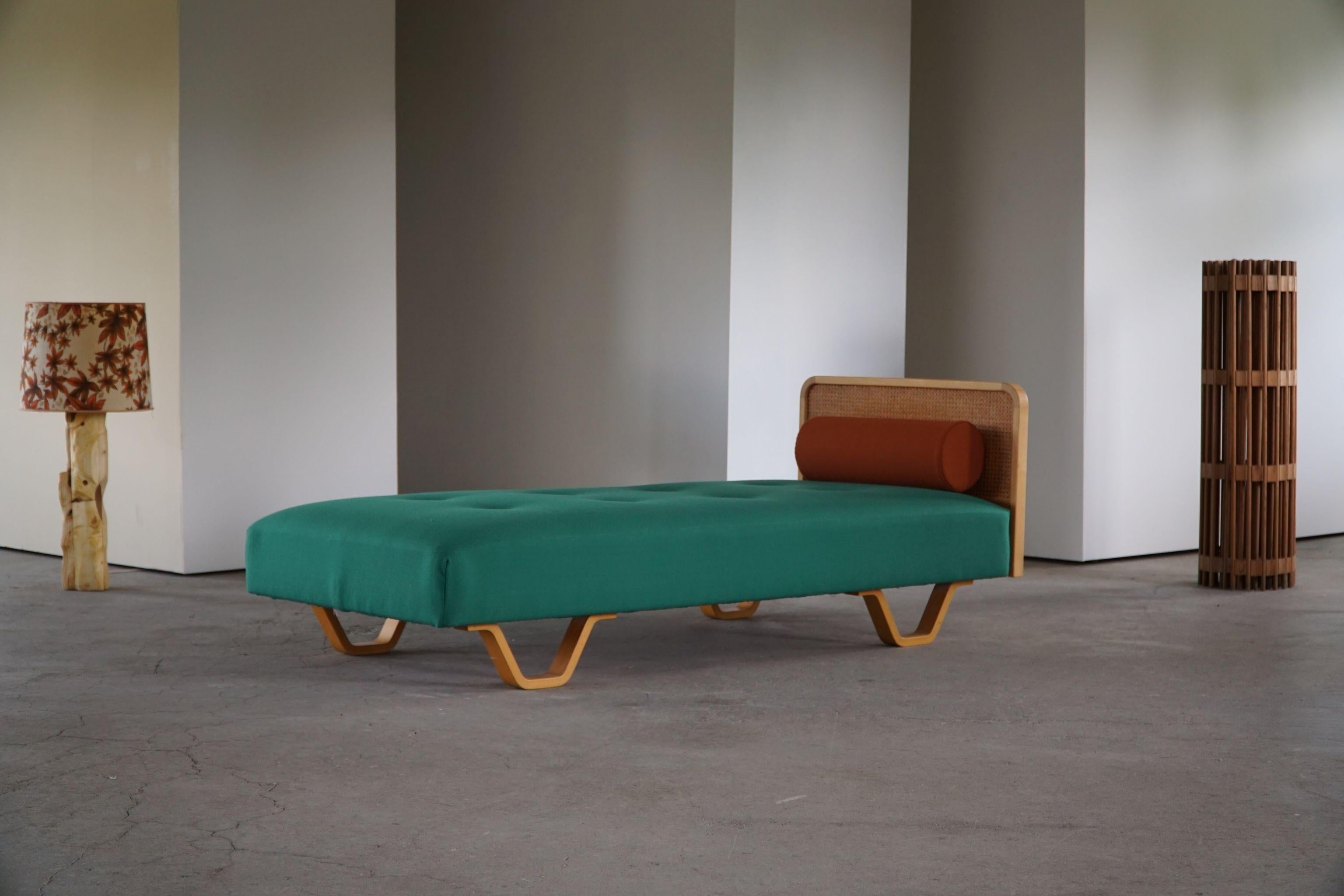 Rare daybed / sofa by GETAMA, Denmark. Reupholstered in green fabric from Kvadrat - great Danish quality. Bed rail in French wicker, legs in solid beech. Fresh colors that complementary the modern interior.

This daybed is in a fantastic vintage