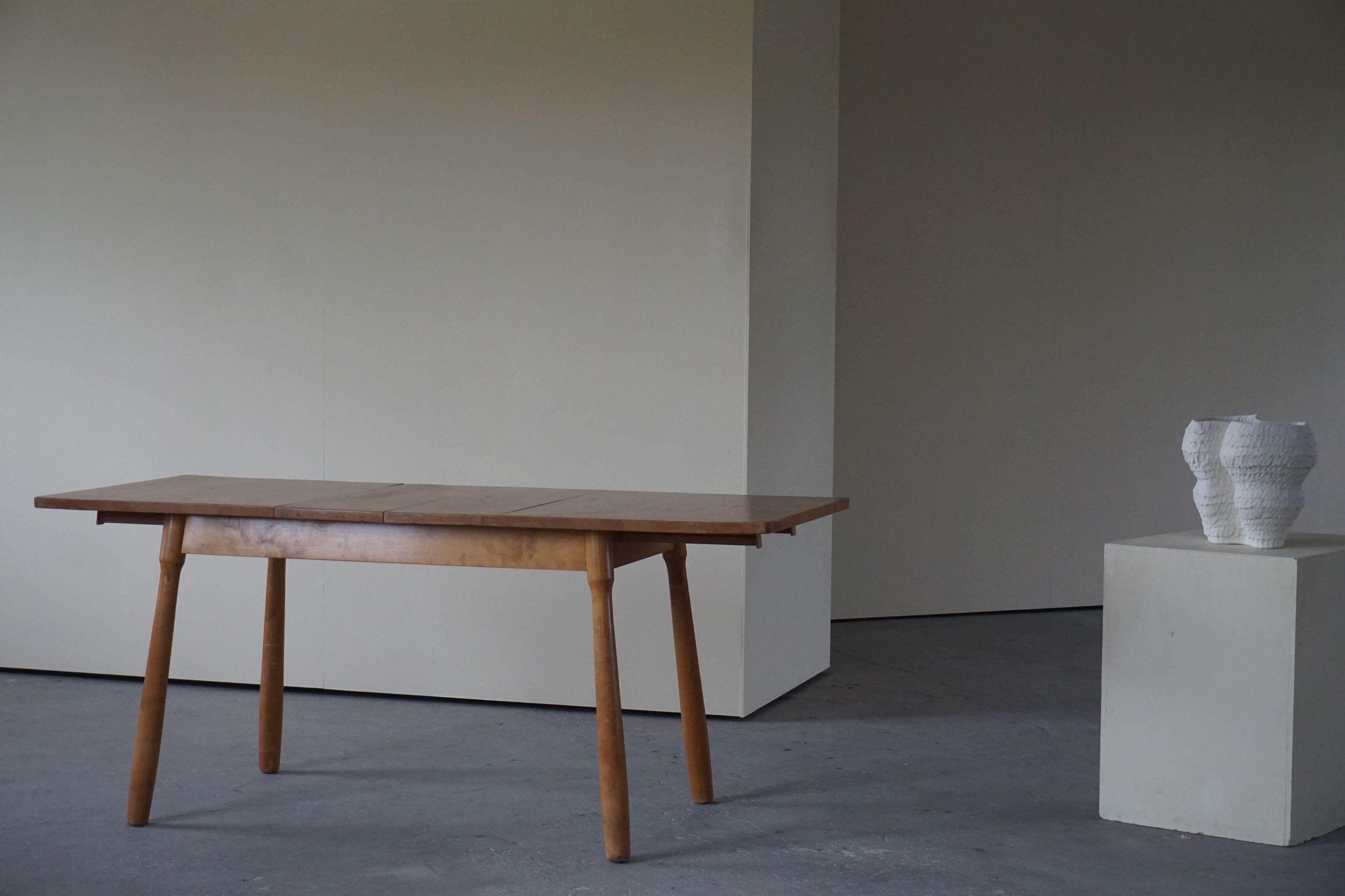 Rare dining table with two extendables made in birch. Attributed to danish designer Philip Arctander. Beautiful structure and lines.
It can also be used as a desk.
Each extendable measure 25cm.