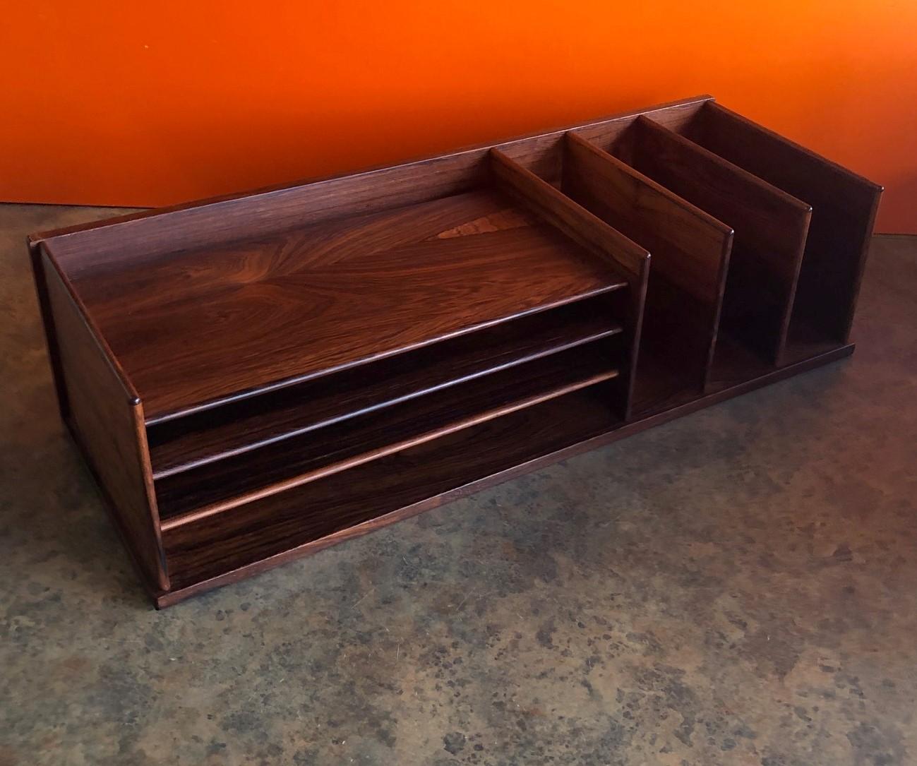 Gorgeous and very functional Danish modern rosewood desk organizer or letter tray by Georg Petersens, circa 1960s. The piece is in excellent condition and measures 23.5