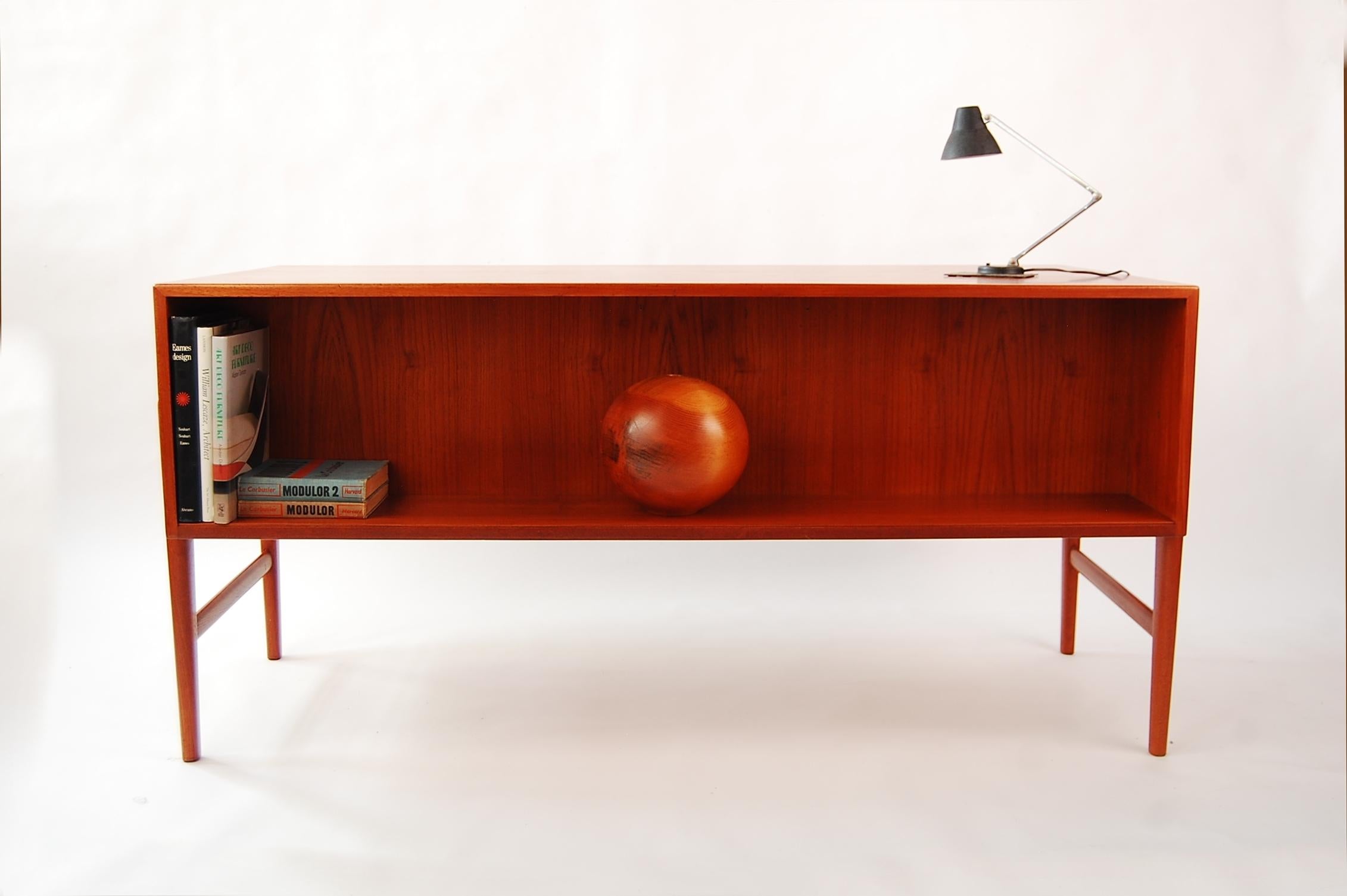 Danish desk in teak and brass, with storage front, attributed to Arne Vodder, circa 1967. Great scale, dovetailed drawers. A very well designed and built desk.