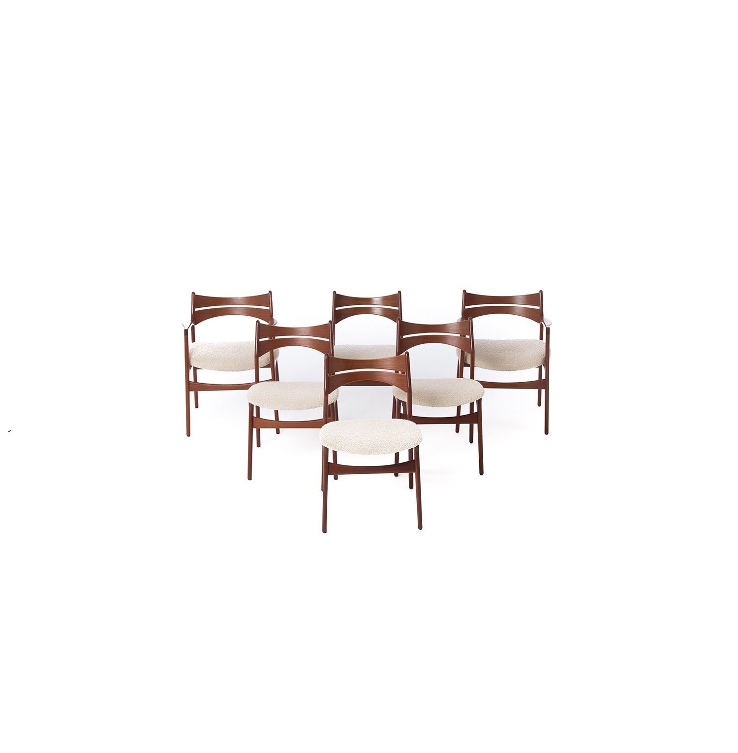 This set of 6 teak dining chairs features two captain's chairs and four side chairs. The backrest's accentuated curvature mixed with the plush wool bouclé seat makes the chairs both striking and comfortable. Fabric is in excellent condition with no