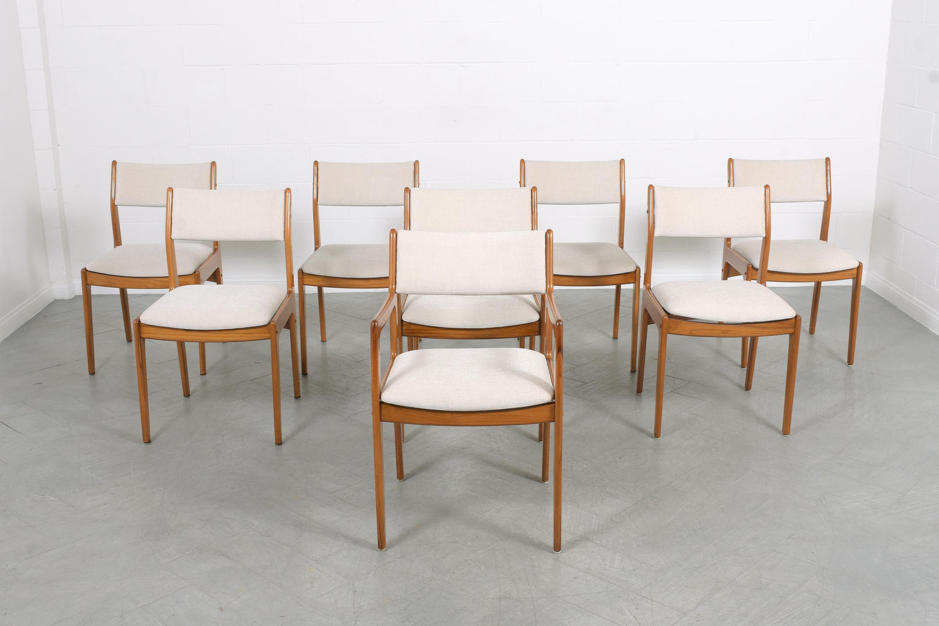 Indulge in the exceptional allure of this extraordinary set of eight Modern Danish dining room chairs. Artisanally handcrafted from robust teak wood, these chairs are preserved in great condition, following complete restoration, refinishing, and