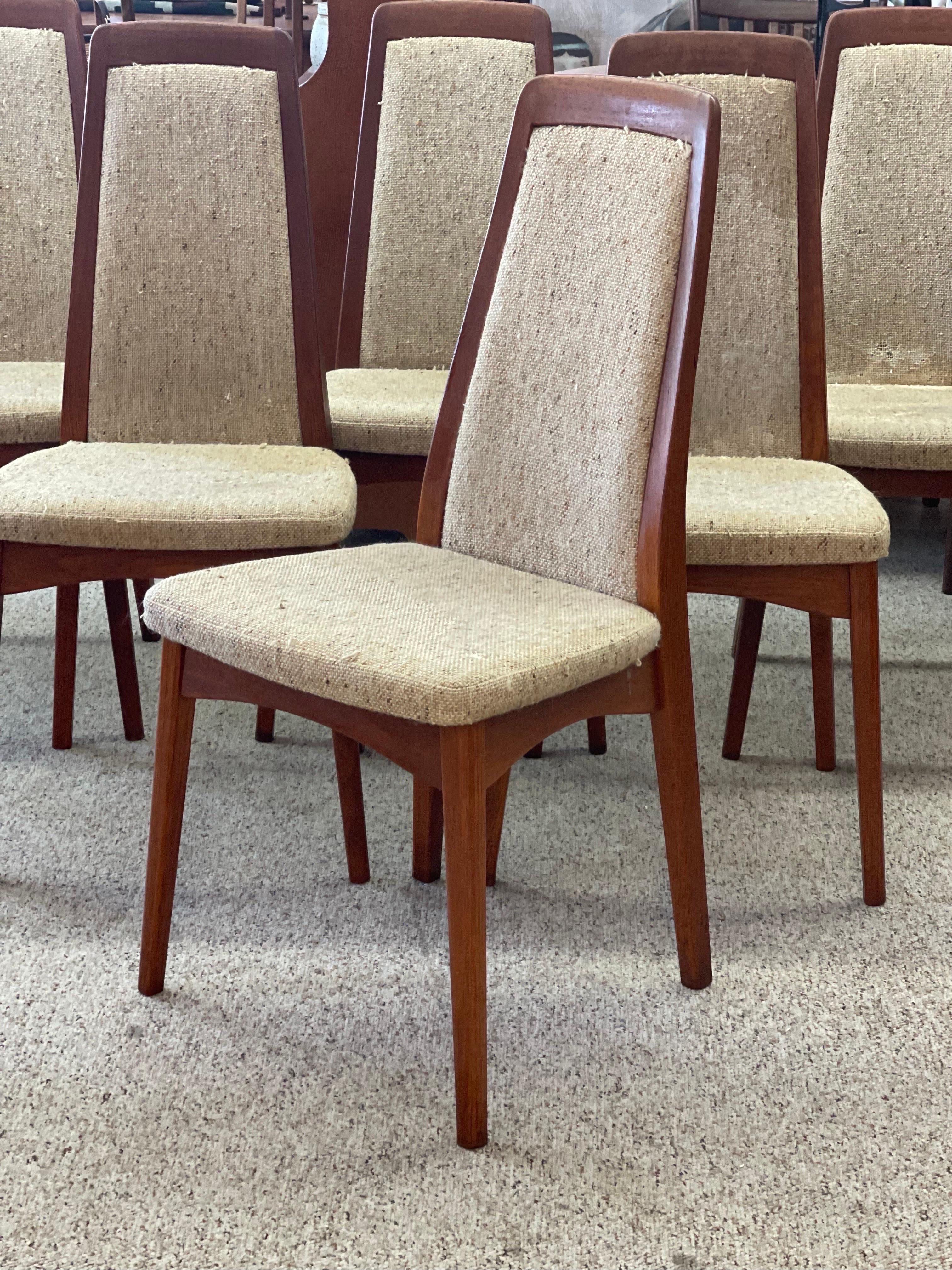 Danish Modern Dining Chairs with Designers Stamp

Chairs Priced as - is. Reupholstery may be Required 

Dimensions. 18 W ; 18 D ; 38 H
Seat Height. 19.