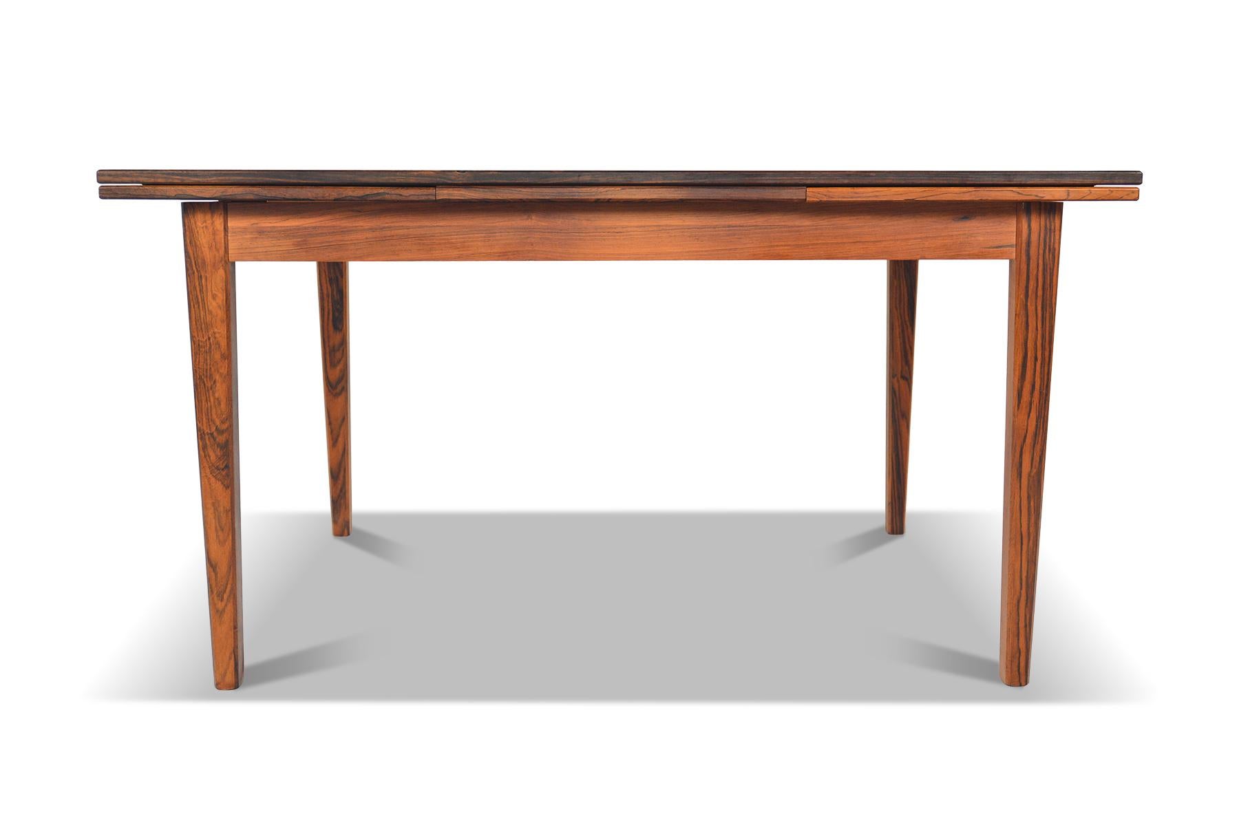 Origin: Denmark
Designer: E.W. Bach
Manufacturer: Seijling Skabe
Era: 1960s
Materials: Rosewood
Measurements: 54.5? long x 34.5? deep x 29? tall 
Expanded (both leaves): 89.5? long x 34.5? deep x 29? tall 

Condition: In good original