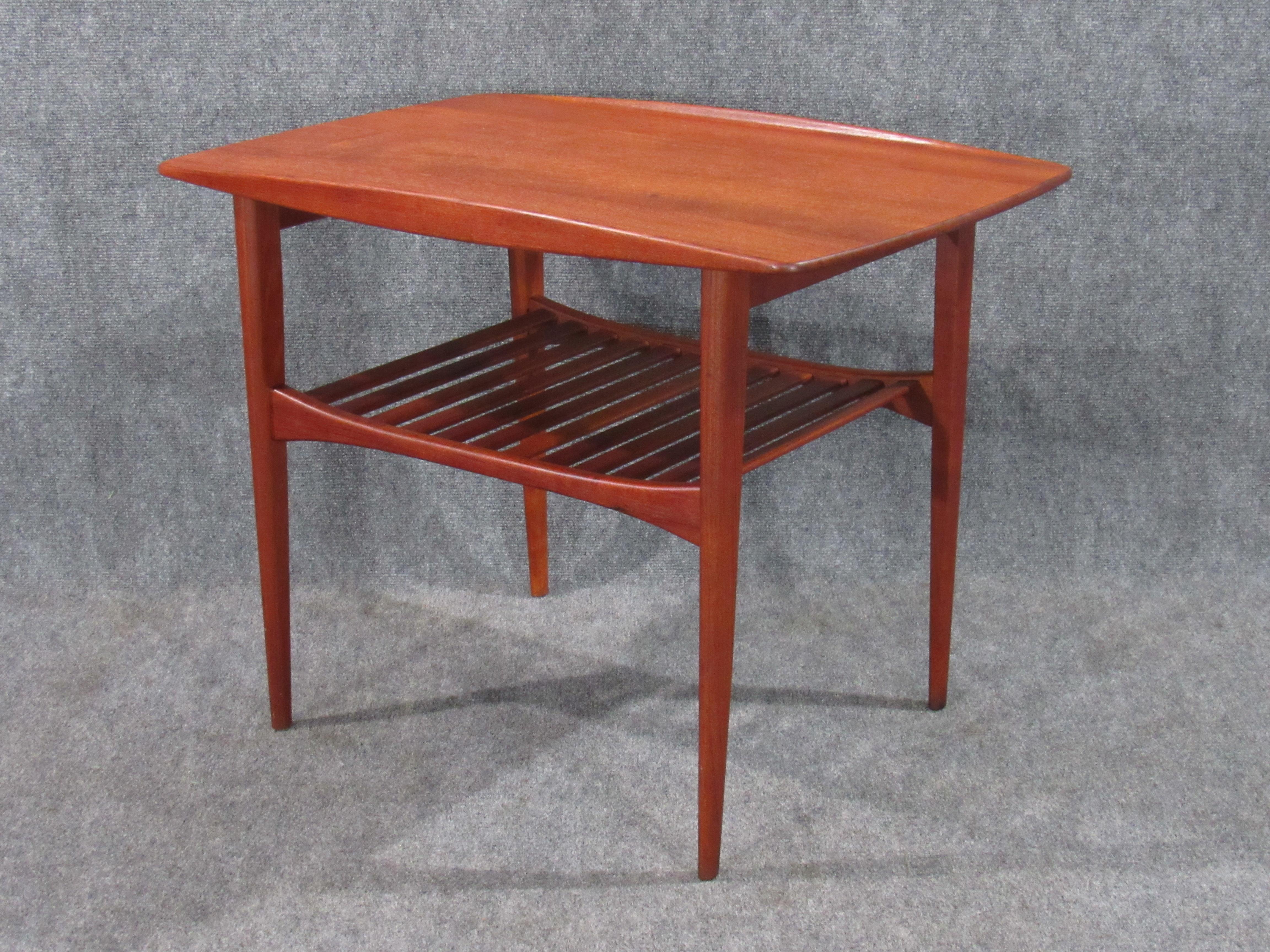 Danish modern early Finn Juhl teak table for France and Daverkosen. An early example of a classic design by the master - Finn Juhl, circa 1950s. Numbered 510 of 1015 in marker, FD stamp and John Stuart metal badge (distributor) on underside of piece.