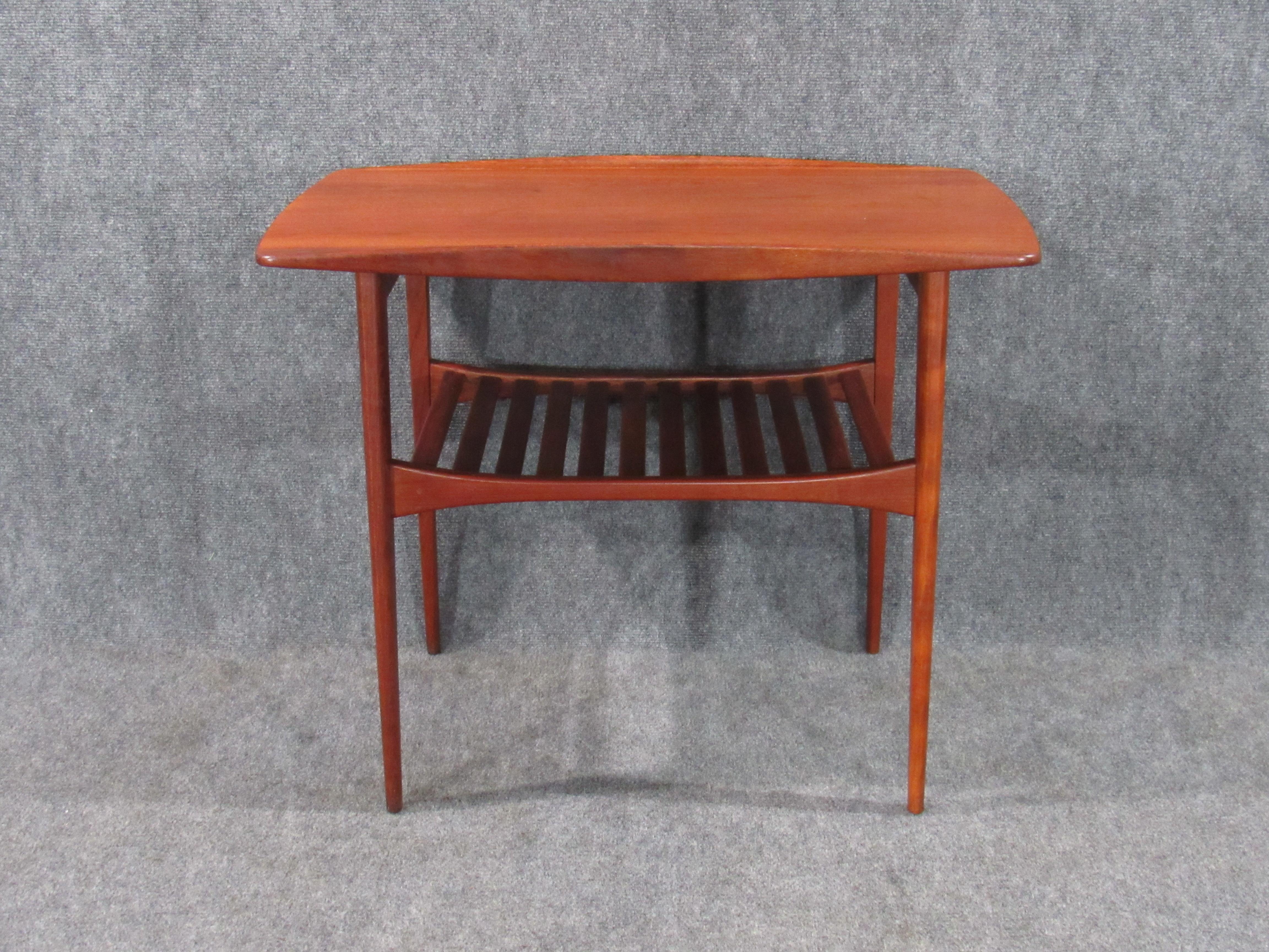 Danish modern early Finn Juhl teak table for France and Daverkosen. An early example of a classic design by the master - Finn Juhl, circa 1950s. Numbered 510 of 1015 in marker, FD stamp and John Stuart metal badge (distributor) on underside of piece.