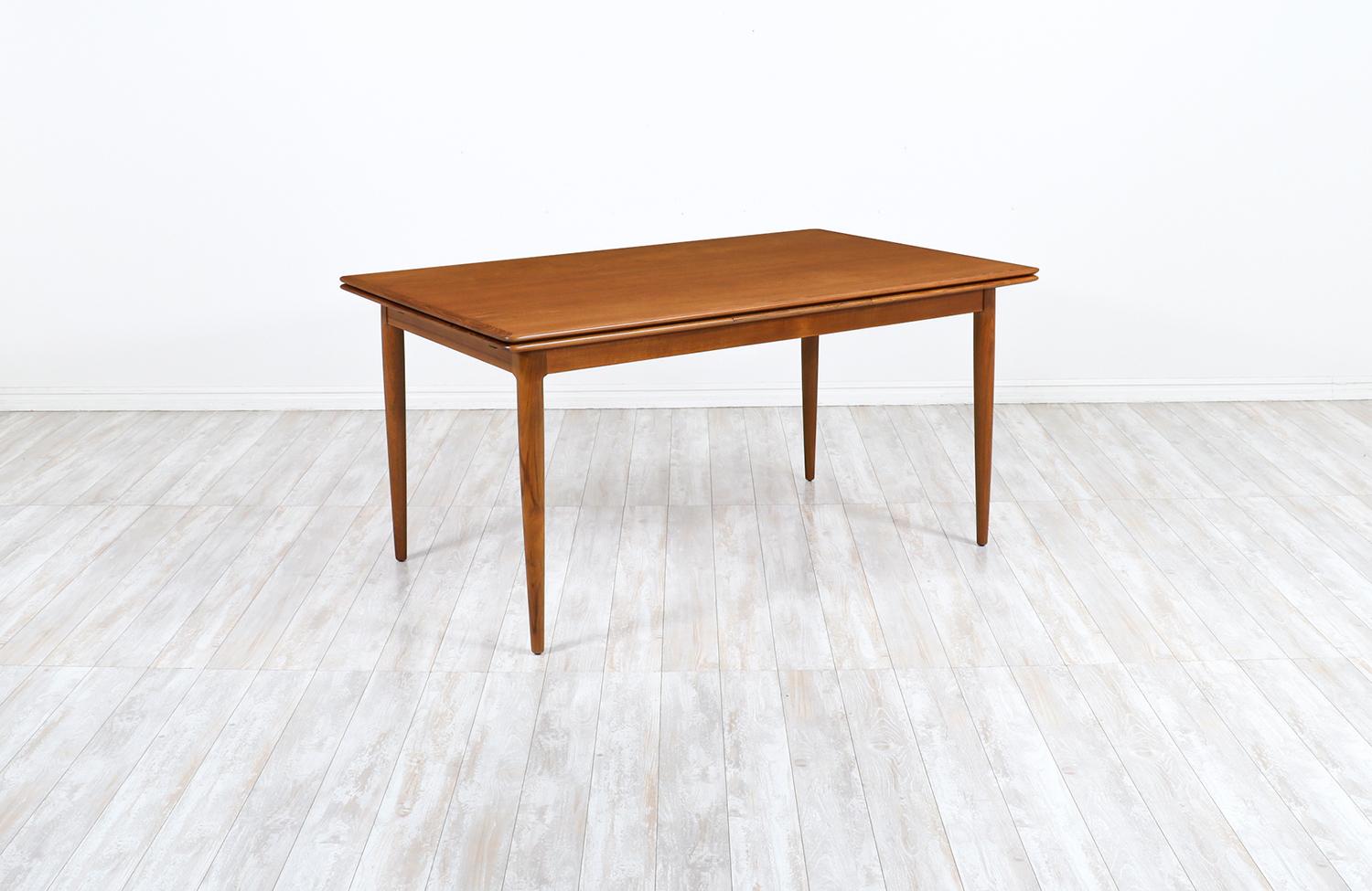 Danish modern expanding draw-leaf teak dining table by Skovmand & Andersen.