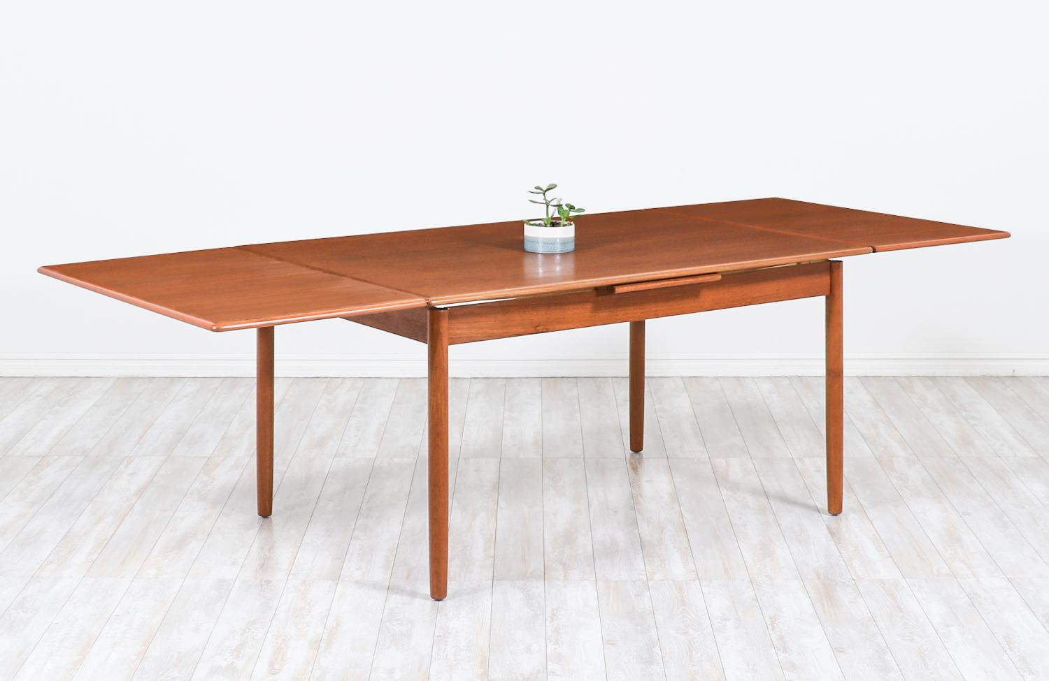 Danish modern expanding draw-leaf teak dining table

Dimensions
29in H x 55in W - 97in W x 39in D
Each extension leaf 21in.