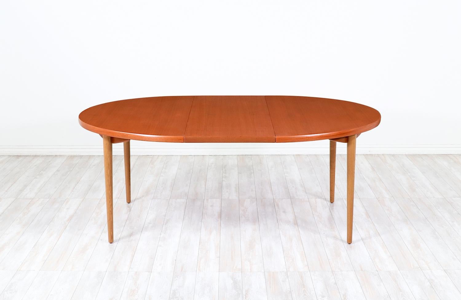 Swedish Expertly Restored - Danish.Modern Expanding Oval Teak & Oak Dining Table For Sale