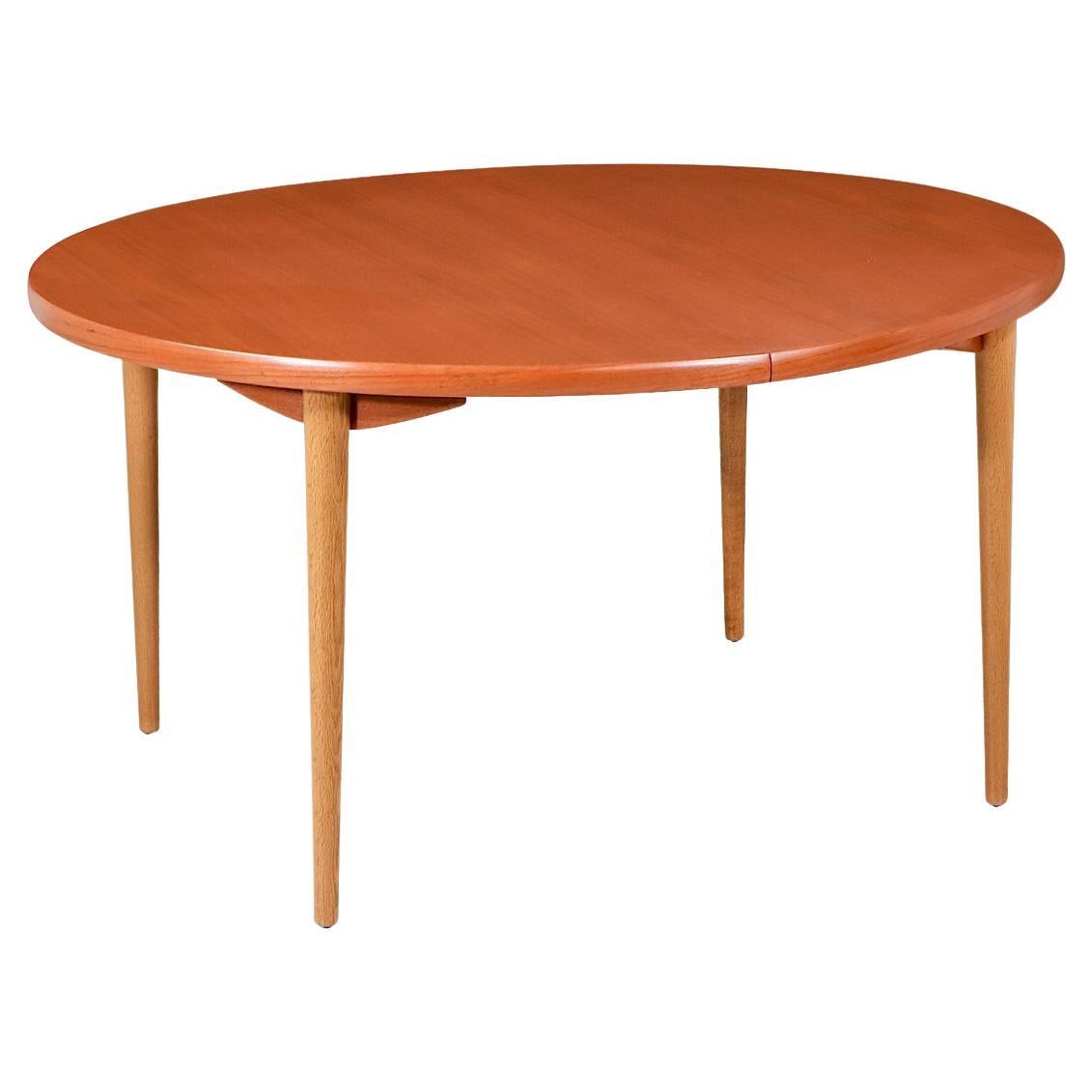 Expertly Restored - Danish.Modern Expanding Oval Teak & Oak Dining Table For Sale