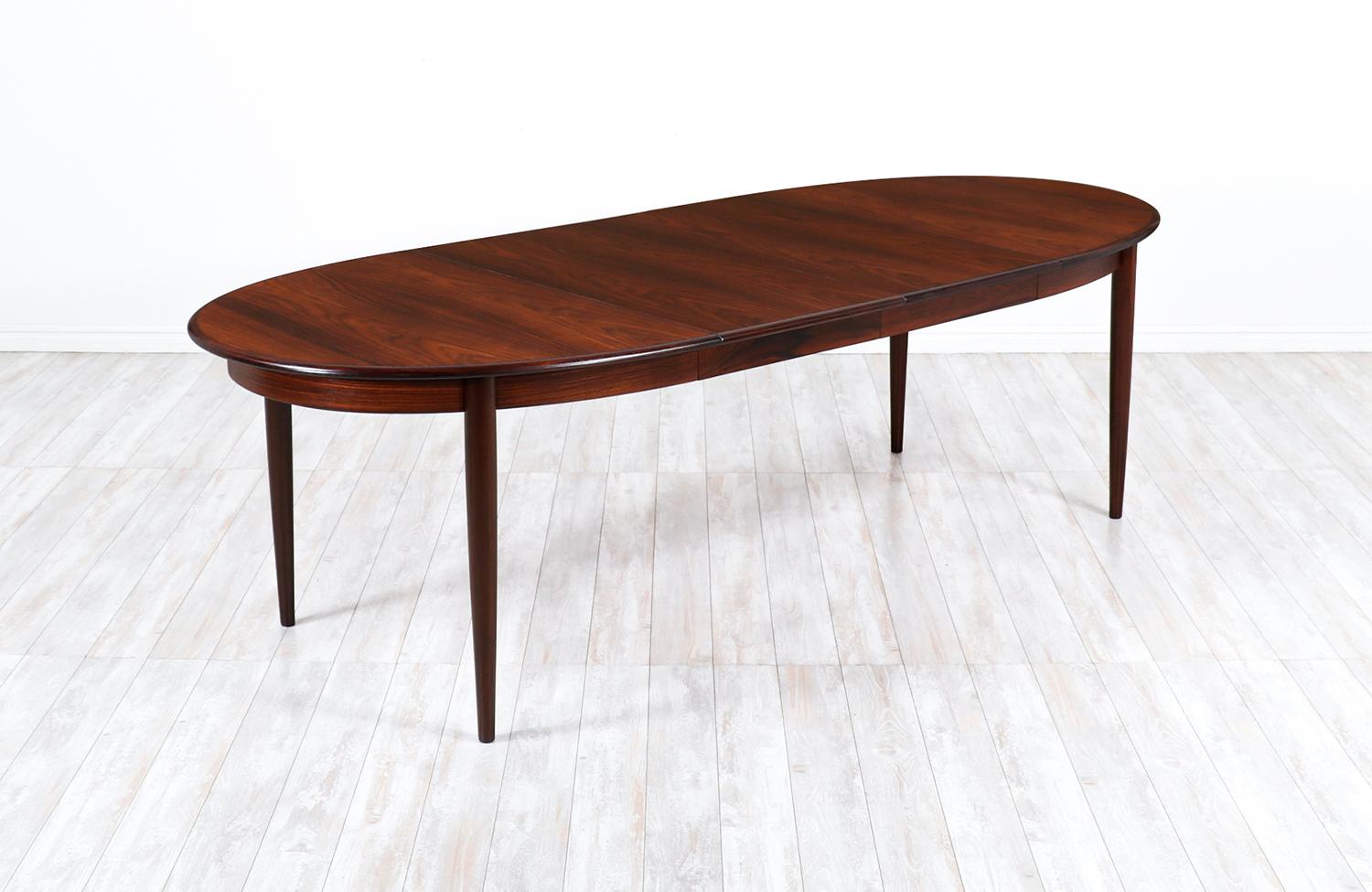 Danish modern expanding rosewood dining table by Gudme Møbelfabrik.