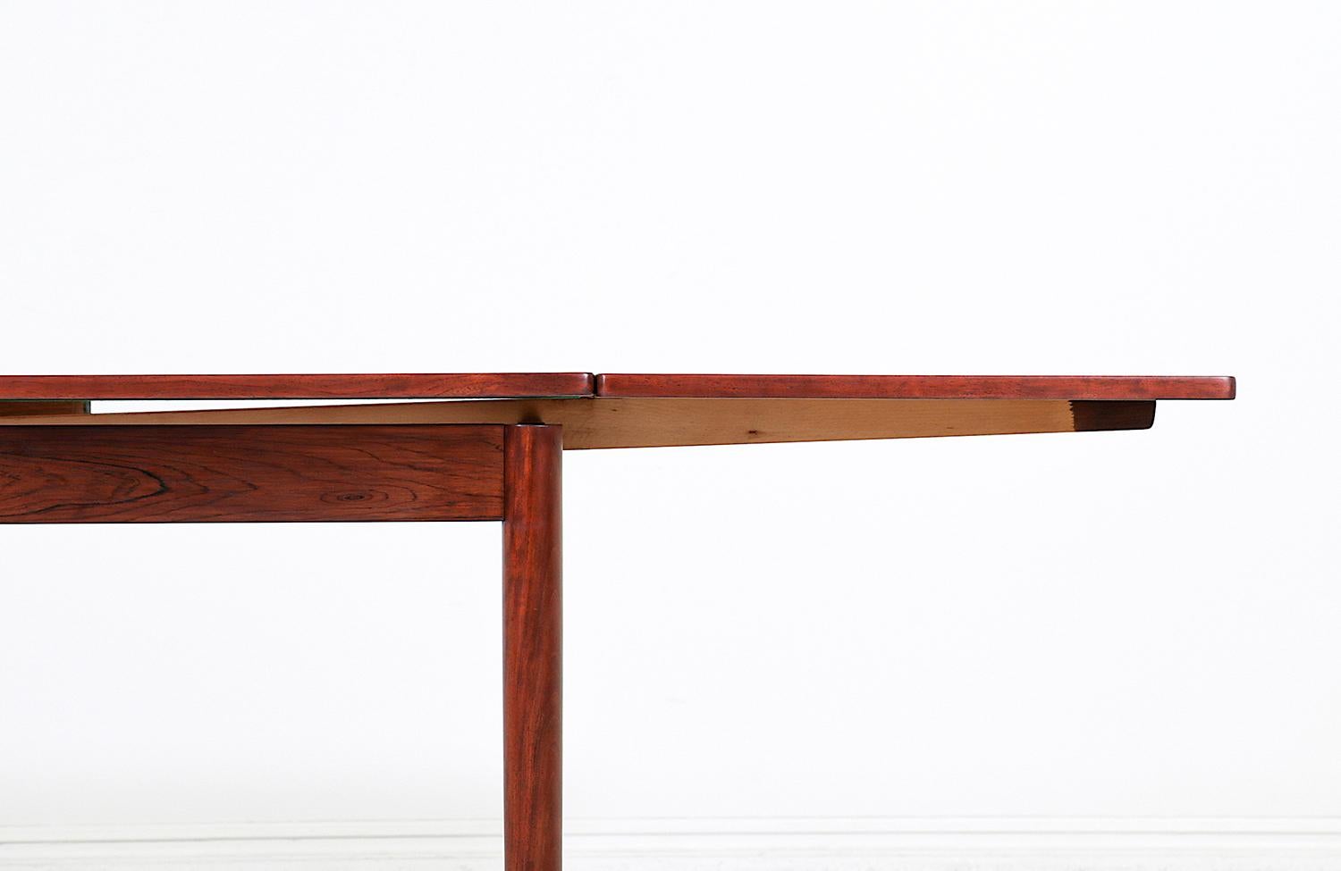 Danish Modern Expanding Rosewood Dining Table with Draw-Leaves 1