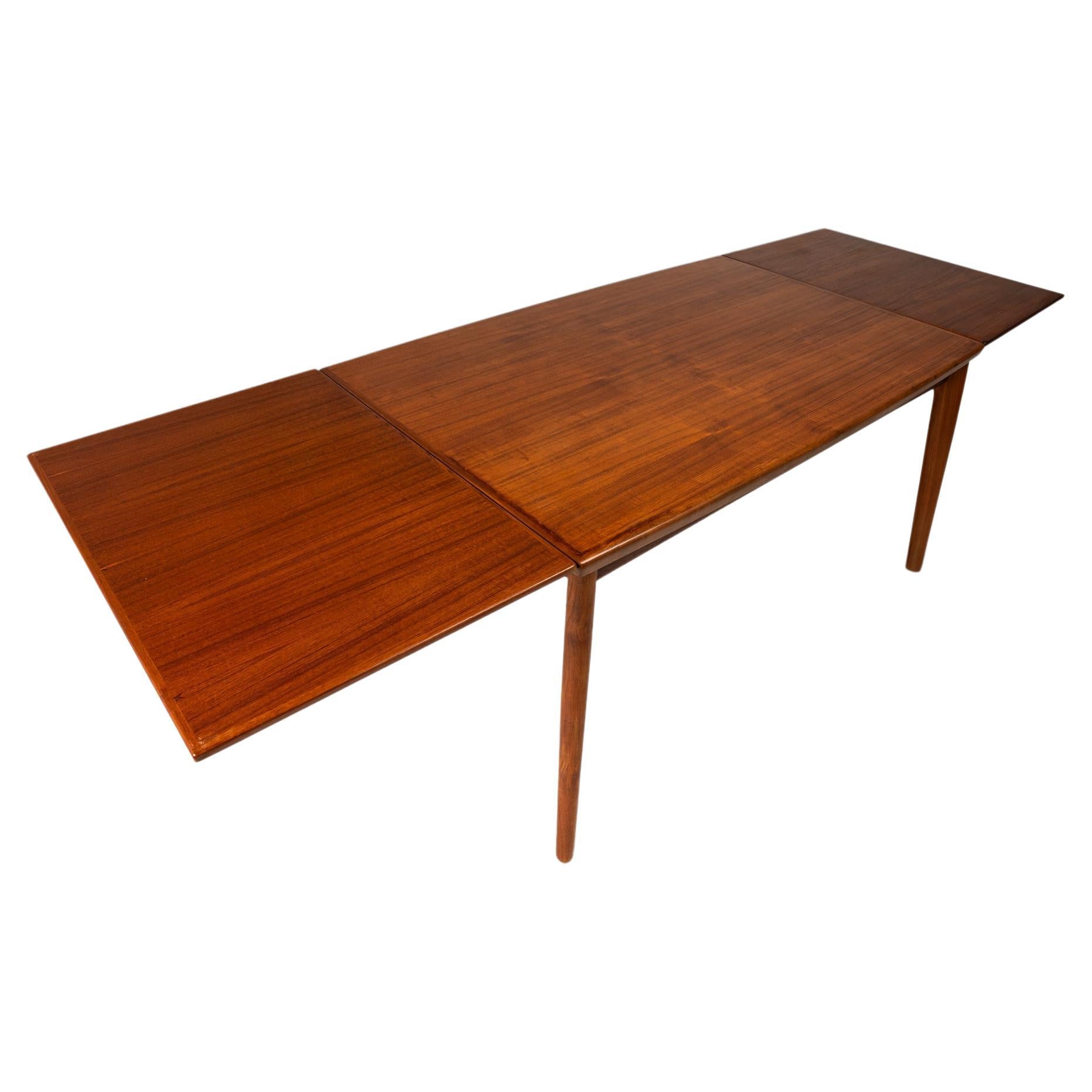 Danish Modern Expansion Dining Table in Teak w/ Stow-in-Table Leaves, c. 1960s For Sale