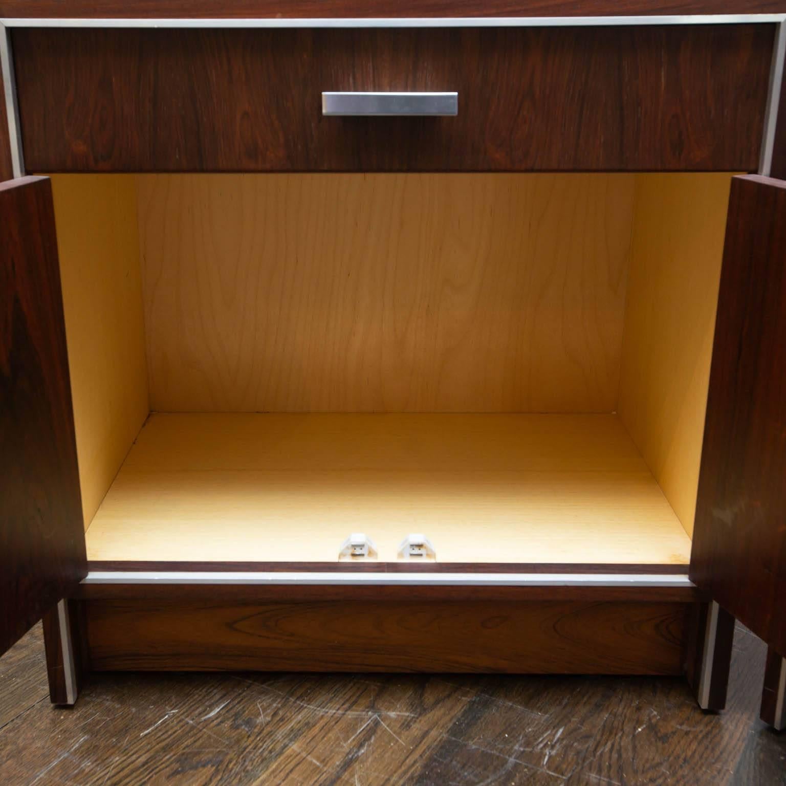 Made by Falster of Denmark, these nightstands match a highboy dresser in another listing. These particular rosewood pieces by Falster were sold at Maurice Villency in New York and Roitman & Son in Providence, Rhode Island.