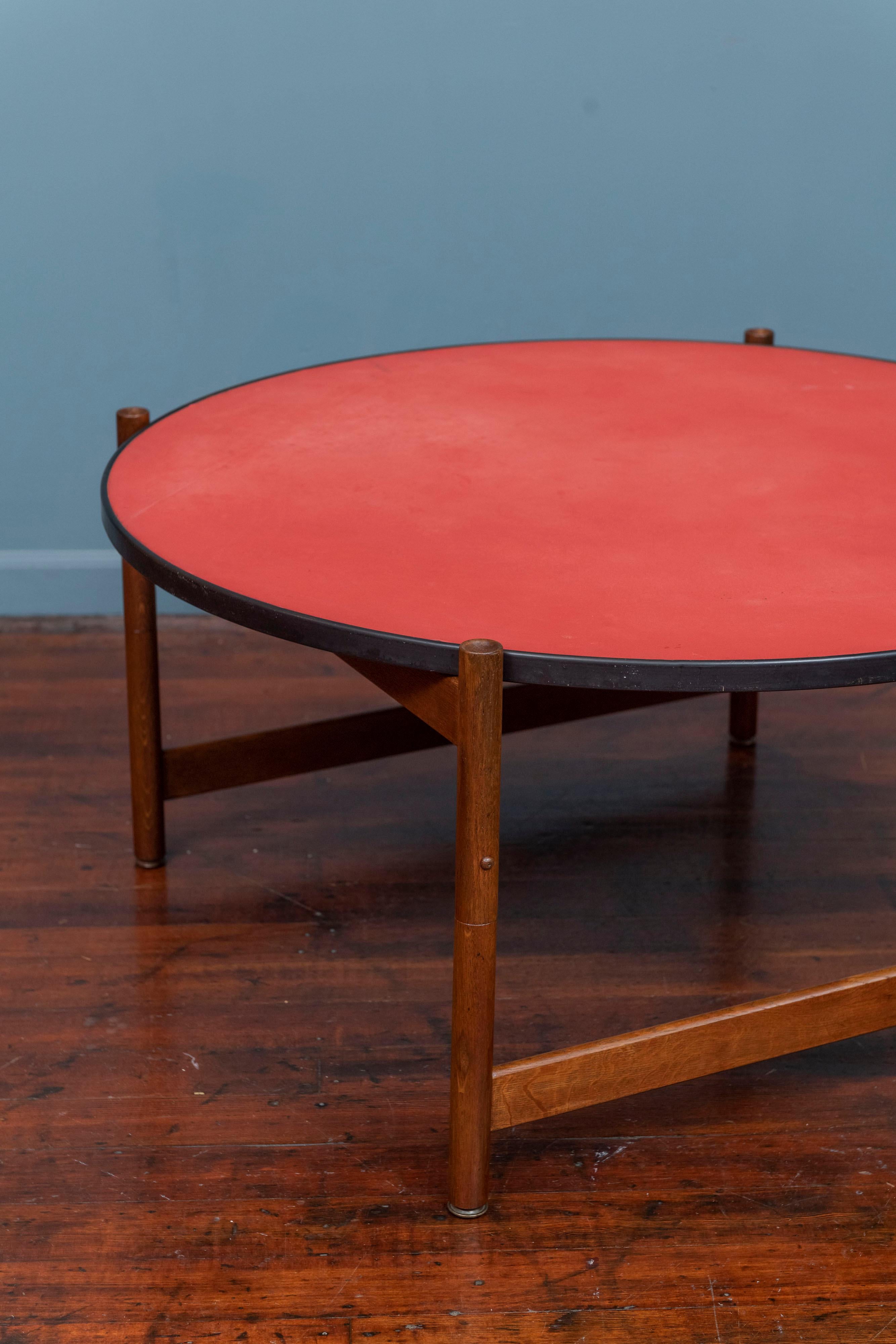 Danish Modern flip top coffee table attributed to Ludvig Pontoppidan, Denmark. Interesting and practical reversible top and collapsible coffee table. 
Newly refinished oak base with dimpled legs that folds up to be portable or used for serving food