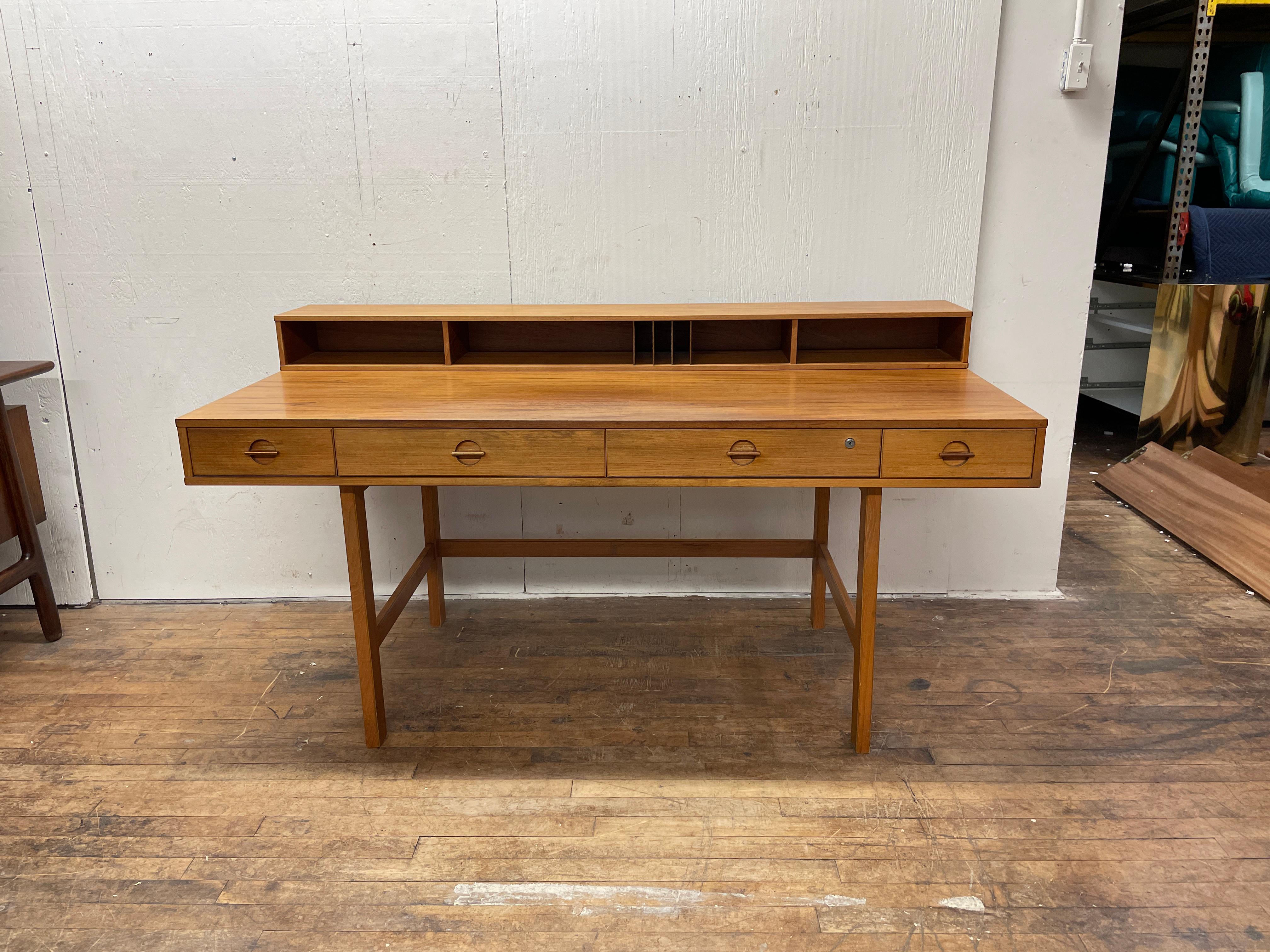 This danish modern desk by Jens Quistgaard is an icon of midcentury design. Anthony Bourdain famously owned one due to Quistgaard's connection to midcentury kitchenwares. It is an adaptable piece with four drawers, multiple organizational cubbies,