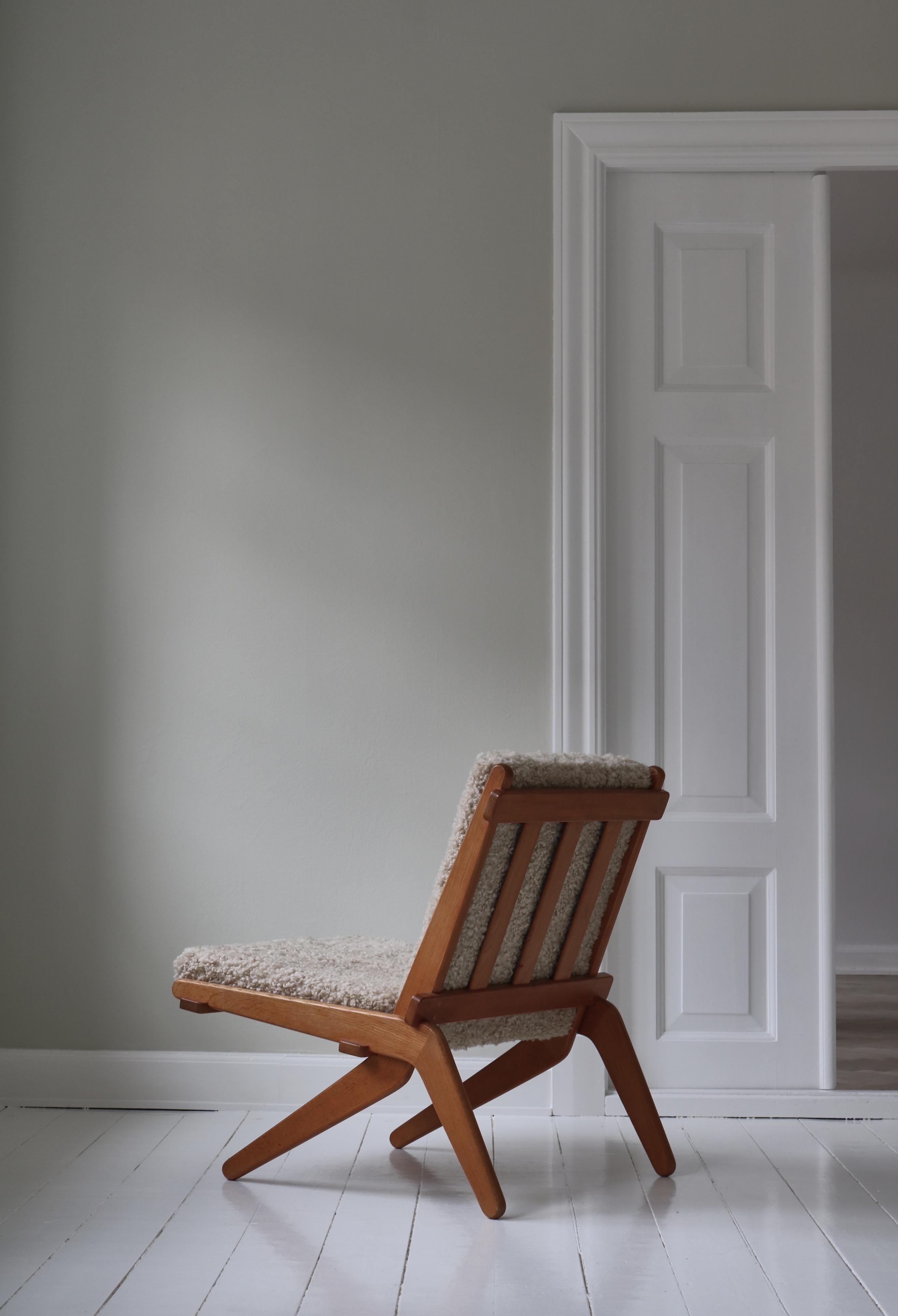 Rare and iconic Danish scissor folding chair in solid oak by Preben Thorsen for cabinetmaker Morten Olsen & Son. This chair was made in very limited numbers in 1957 and is a very rare find. The design is brilliant and ingenious as the chair consists