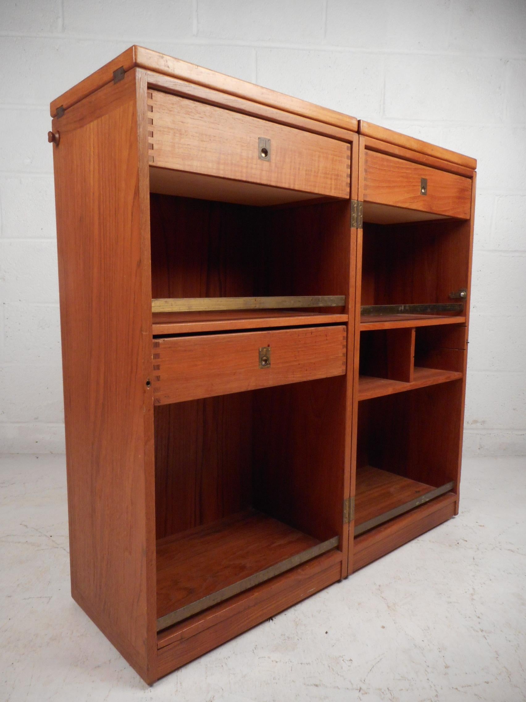 Stunning Danish dry bar designed by Reno Wahl Iversen, made in Denmark, circa 1960s. Great design featuring felt-lined drawers complete with dovetail jointing, various compartments with brass stretchers securing their contents, and hinged panels on