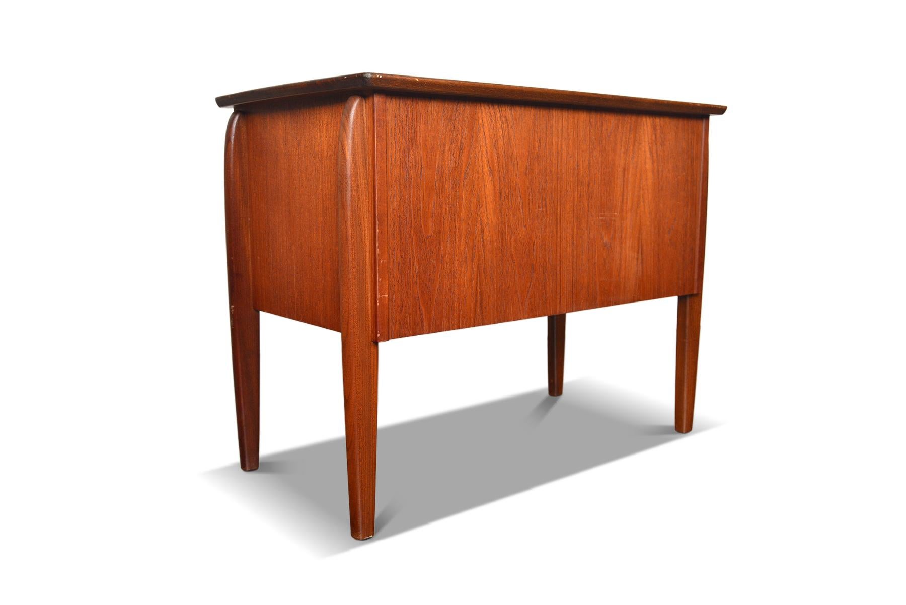 Origin: Denmark
Designer: Unknown
Manufacturer: Unknown
Era: 1960s
Materials: Teak
Measurements: 29.5″ wide x 16.5″ deep x 22.5″ tall

Condition: In excellent original condition with typical wear for its vintage.  Price includes a full exterior and