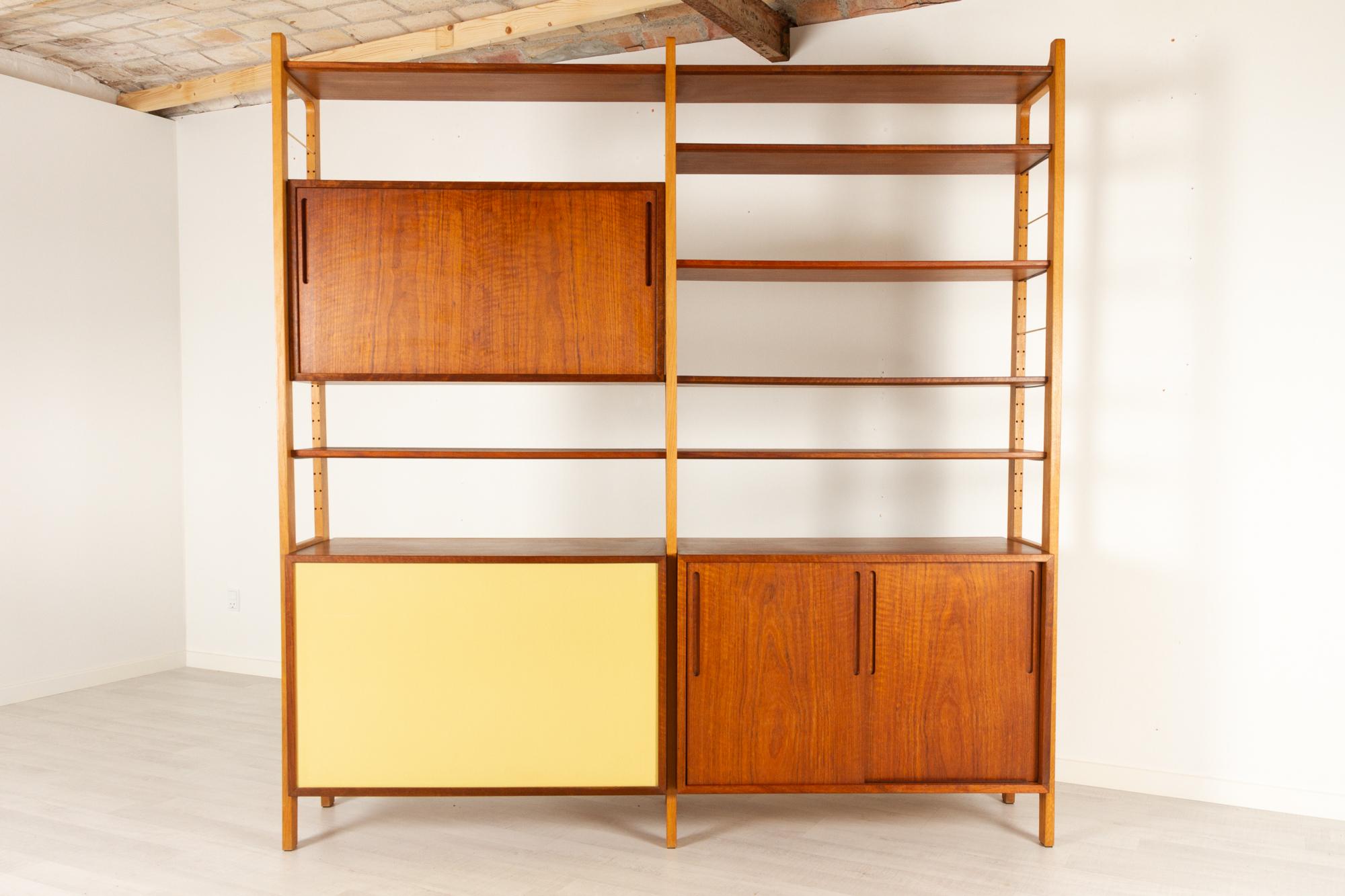 Danish Modern freestanding bookcase by Ib Kofod-Larsen 1954.

Danish modern modular bookcase in Shedua wood and oak designed in 1954 by architect Ib Kofod Larsen and made Brande Møbelfabrik. This is a very rare model, probably the only one that