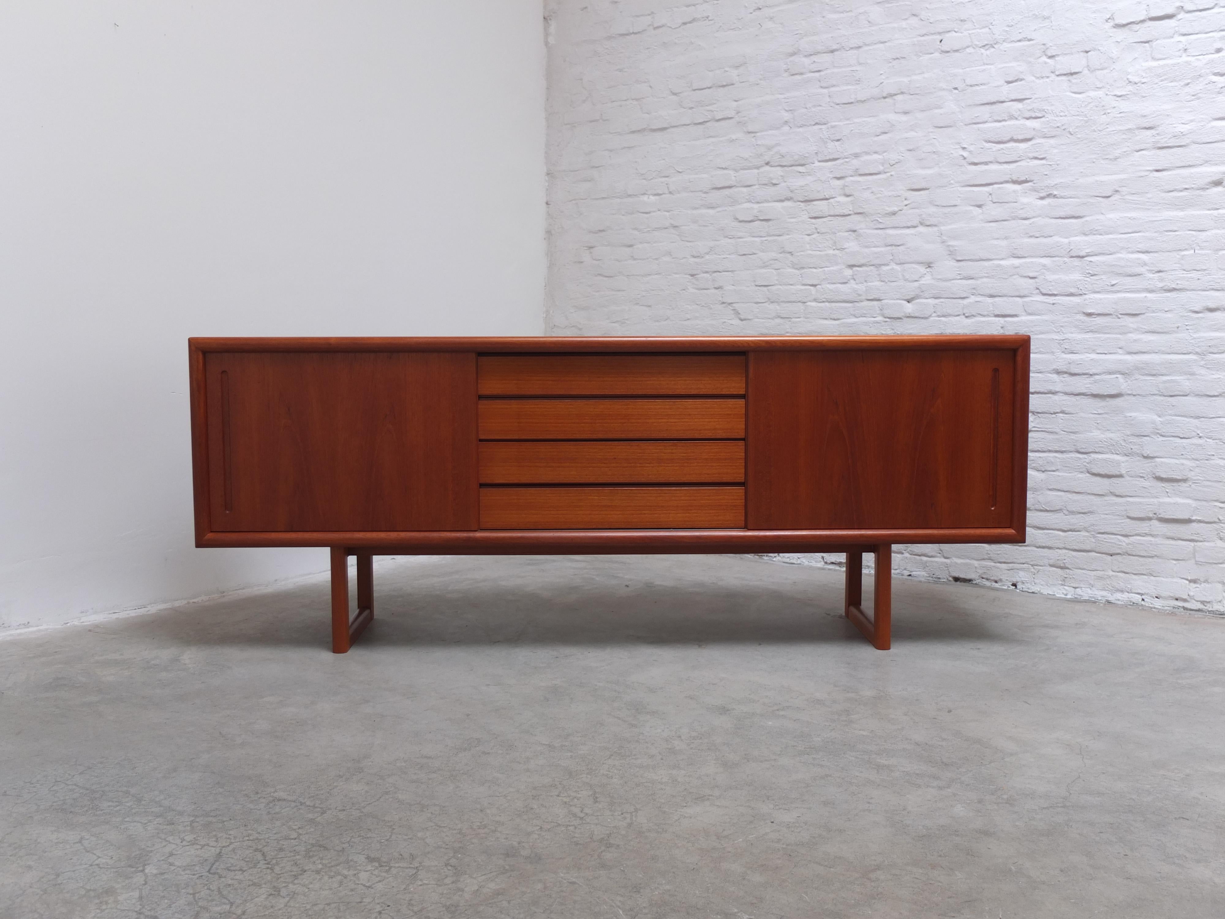 A very beautiful sideboard produced in Denmark during the 1960s. A model I have not seen before and therefor no designer or maker is currently known but this one is built with great craftsmanship. This is visible thanks to the nice teak wood used