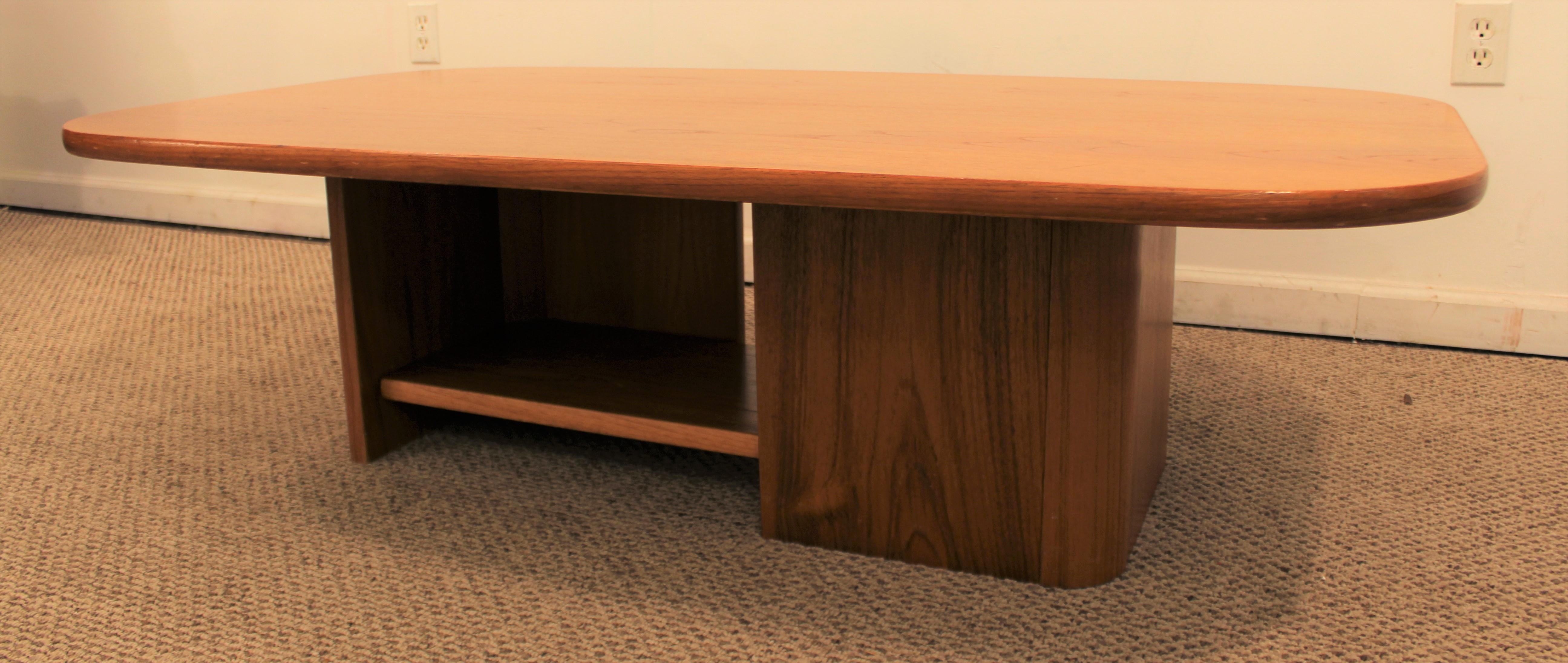 Offered is a teak coffee table by Gangso Mobler. Has a removable shelf on bottom. The table is structurally sound and in good condition. It is not signed.

Dimensions: 
55