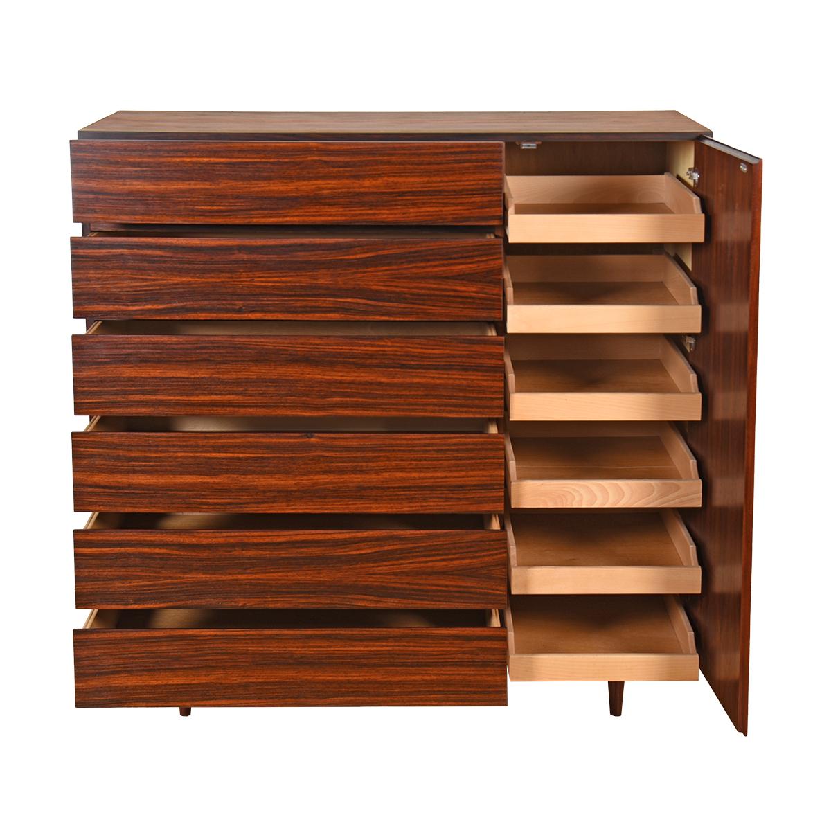 A storage powerhouse, this piece has deep drawers that roll out for your bulkier items and adjustable, shallow drawers for smaller items. The six deep drawers are externally visible while the shallow drawers are hidden behind a door. Gracious Danish
