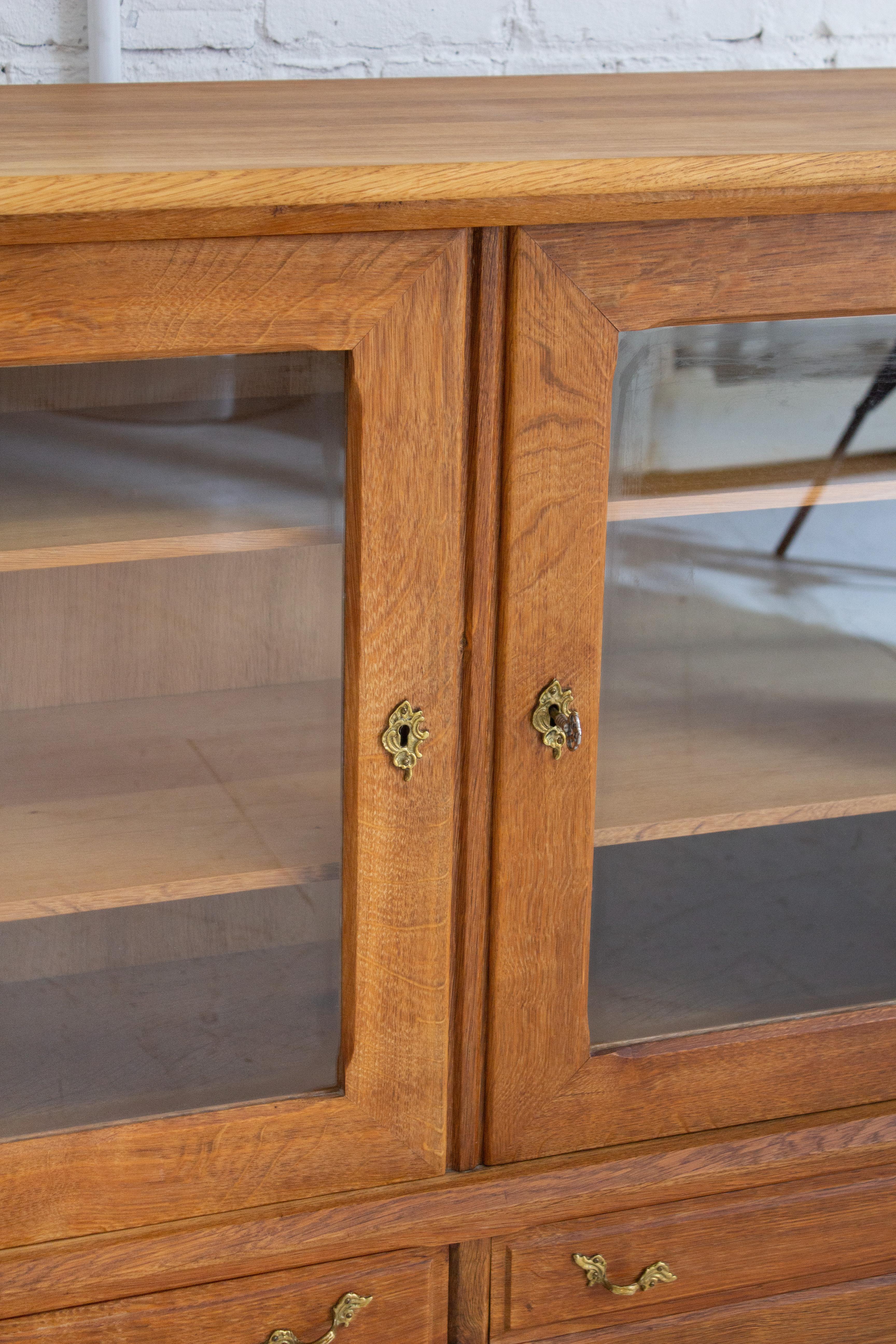 Rustic Danish Modern Glass Front Oak Cabinet Attributed to Henning Kjaernulf For Sale