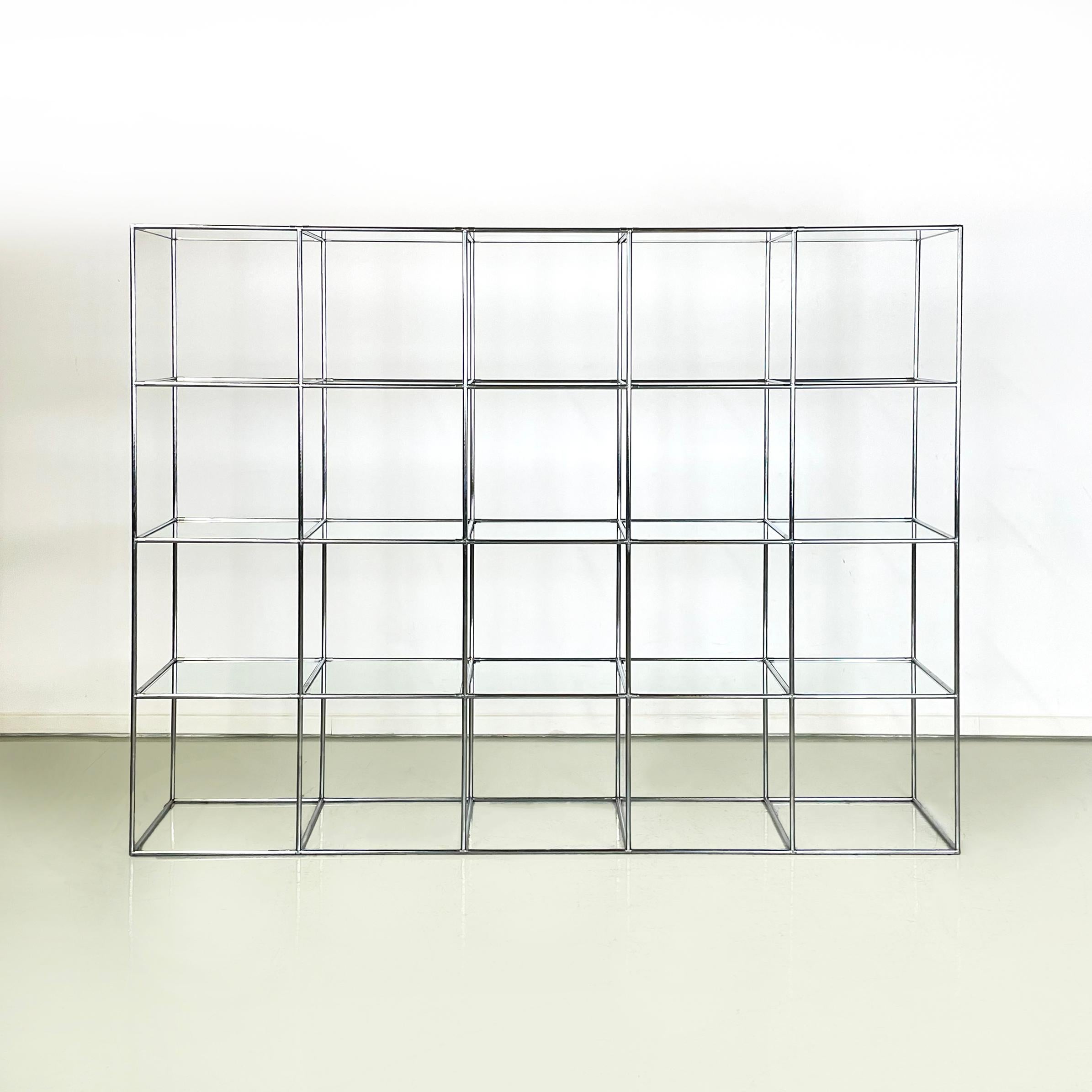 Danish modern glass and metal Bookcase Abstracta by Poul Cadovious, 1960s
Self-supporting floor bookcase mod. Abstracta with rectangular base in metal and glass. The bookcase has 20 glass shelves, resting on the metal rod structure.
Produced in