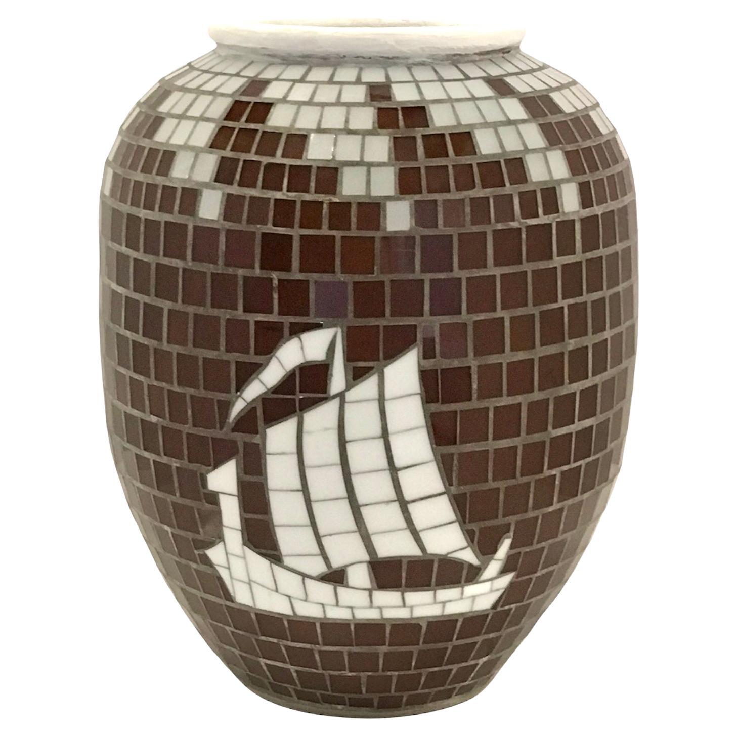 Large Scandinavian Mid-Century Modern pottery vase encrusted with white and deep red glass tiles. Depiction of a Sailing Viking Ship done in white tiles as is the top with swirling snow caps. Unsigned. Attributed to Heide Mosaics of Denmark.
