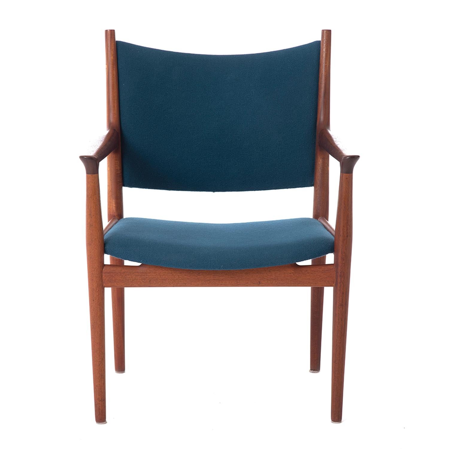 Danish modern teak occasional armchair designed by Hans J. Wegner and produced by Johannes Hansen. Teak frame with blue wool upholstery.

Professional, skilled furniture restoration is an integral part of what we do every day. Our goal is to