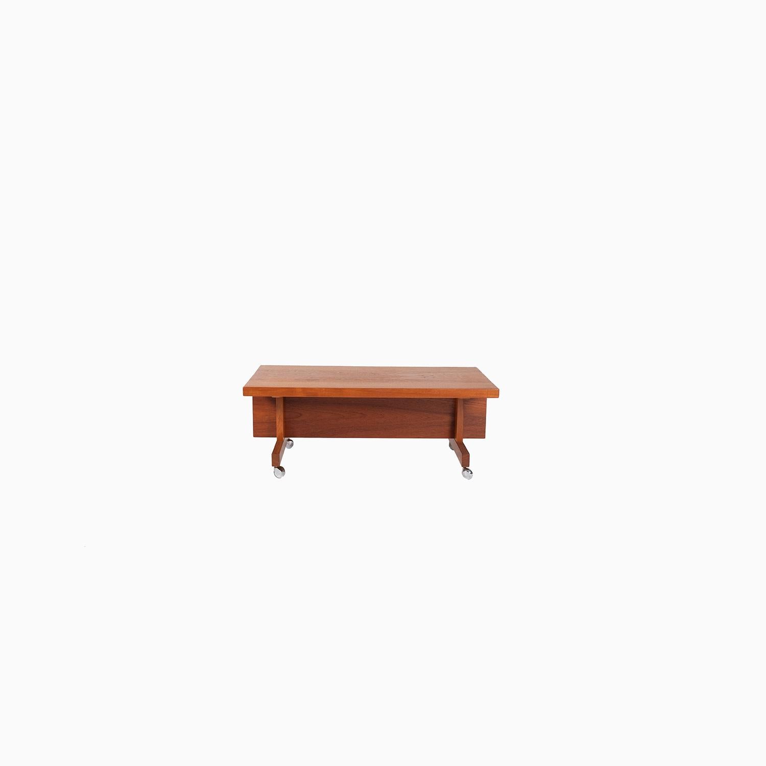 Hans Wegner designed teak occasional table on casters. Originally designed for his wall system produced by RY Mobler. This piece is versatile and functional on its own. 

Professional, skilled furniture restoration is an integral part of what we