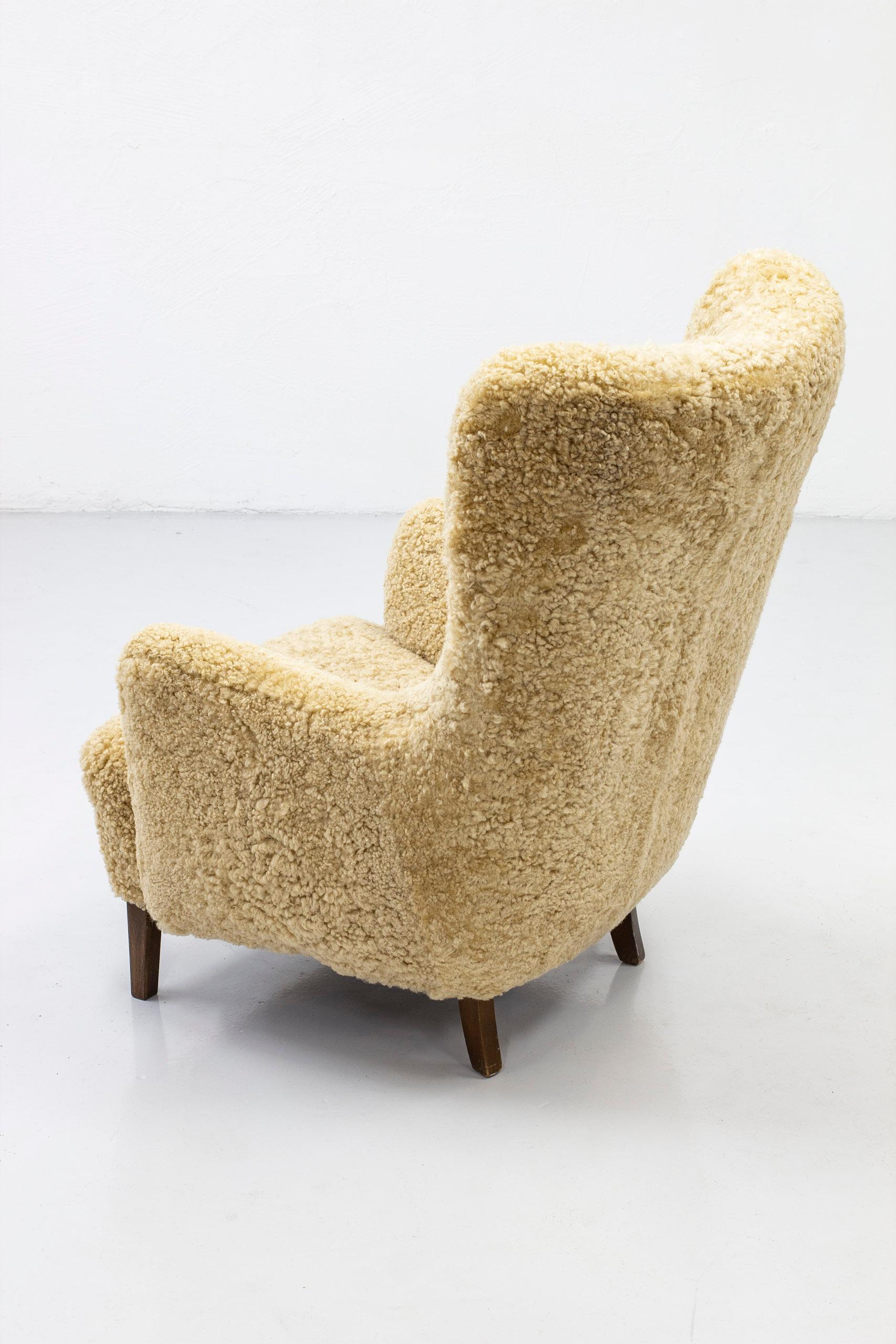 Scandinavian Modern Danish Modern High Back Chair with Sheepskin Upholstery, Denmark, 1950s