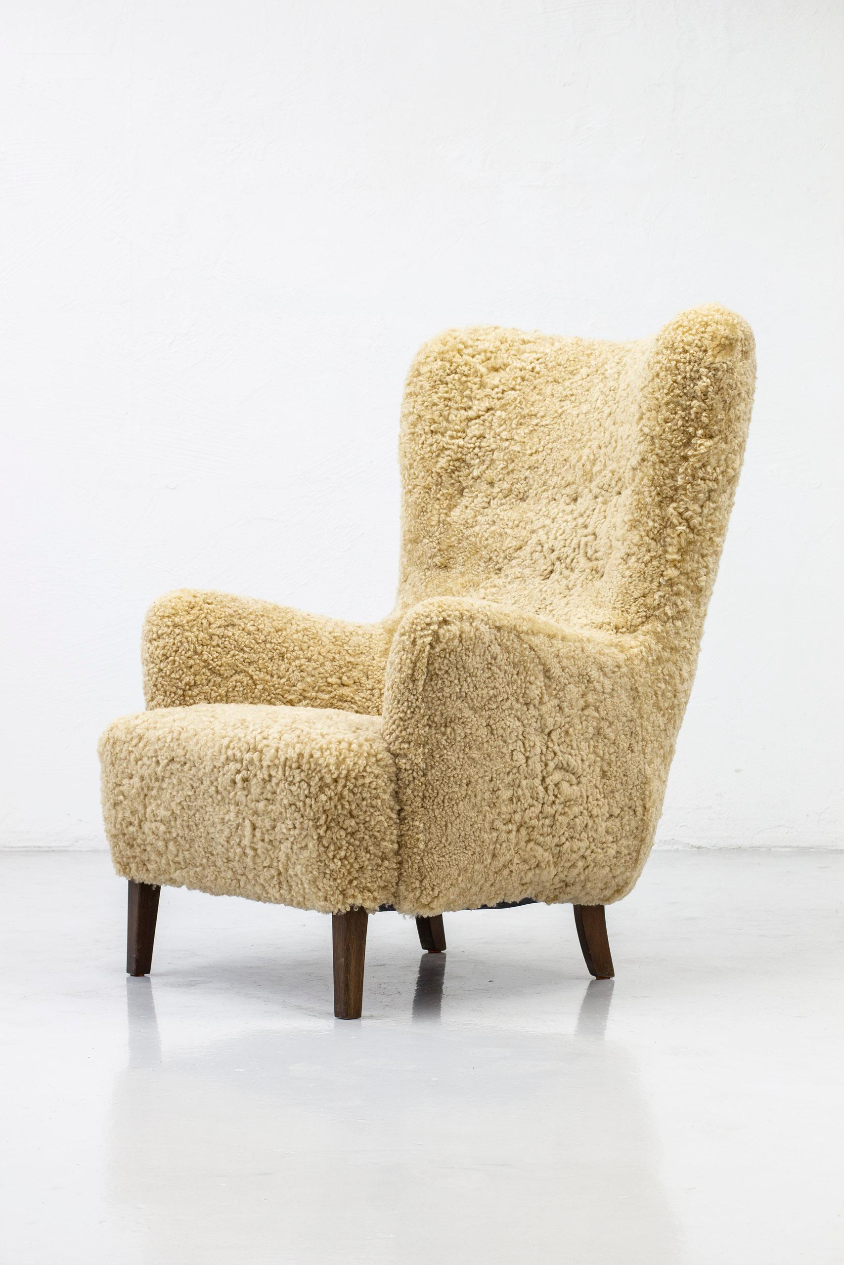 Mid-20th Century Danish Modern High Back Chair with Sheepskin Upholstery, Denmark, 1950s