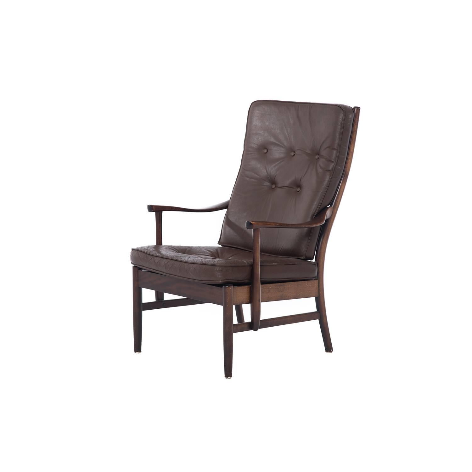 This lacquered beech high back lounge is in original leather upholstery.
