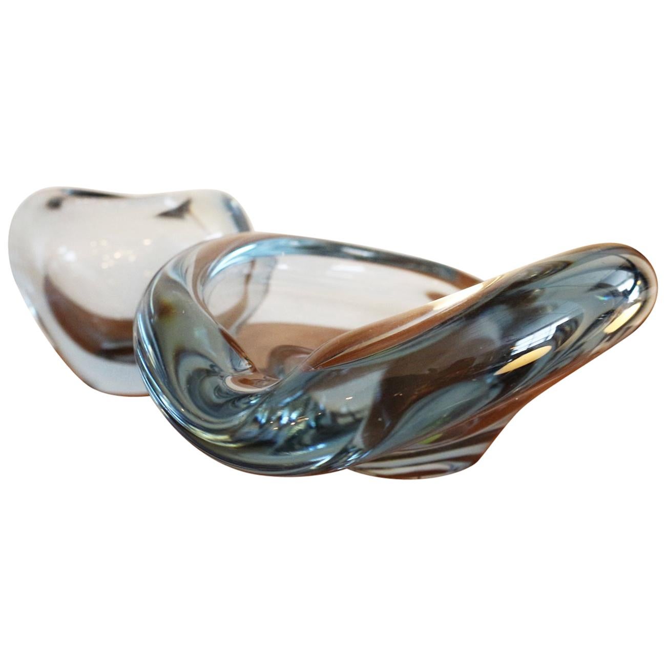 A striking petite Danish modern decorative glass dish. Glass is clear with a faint sky blue color.  Originally intended to be an ashtray this piece is beautiful as a decorative item or could function well as a candy or soap dish.  Measurements are