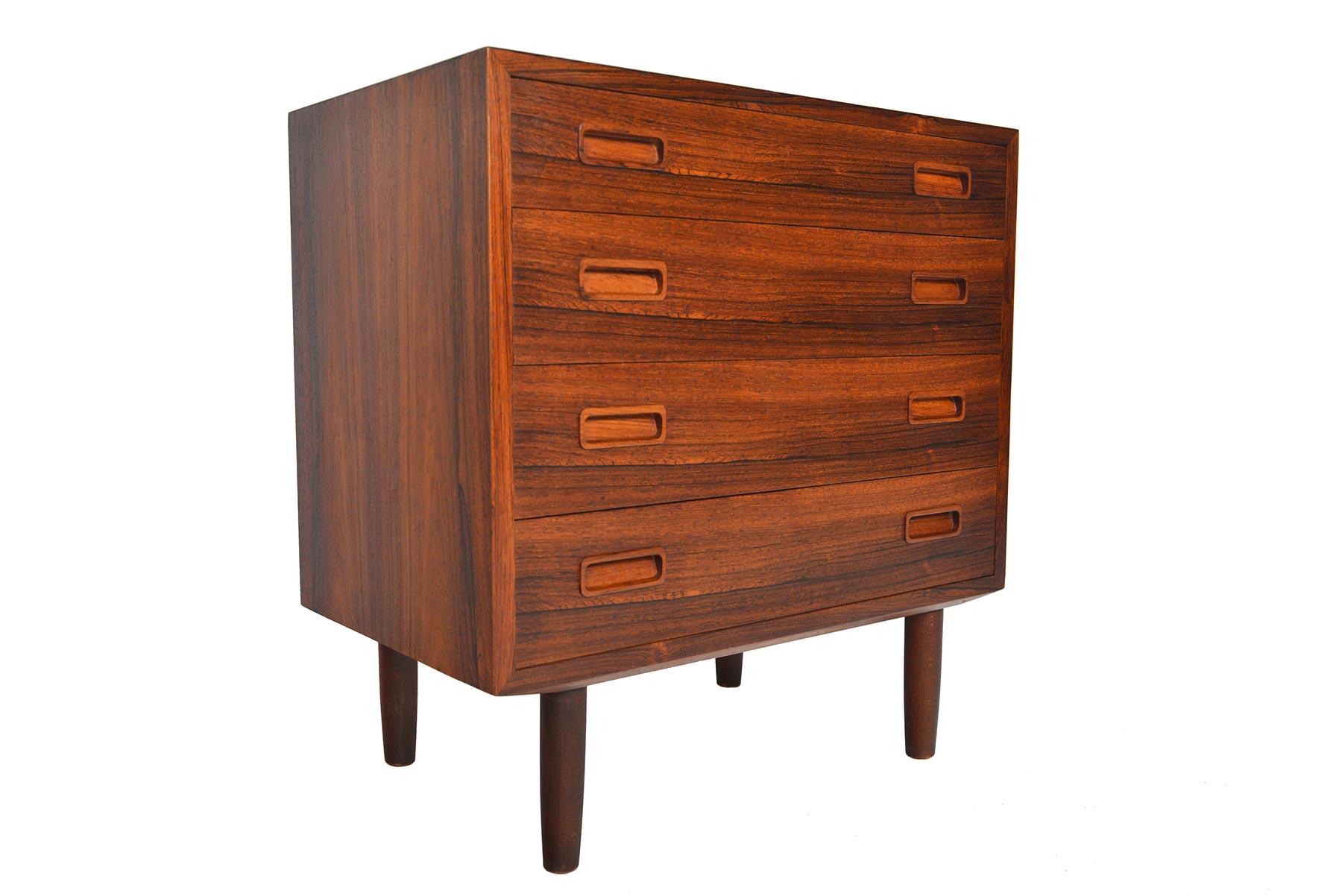 Danish modern midcentury gentleman's chest was manufactured by Hundevad + Co. in the 1960s. Crafted in Brazilian rosewood, this wonderfully sized piece features hand carved rosewood drawer pulls. In excellent original condition.