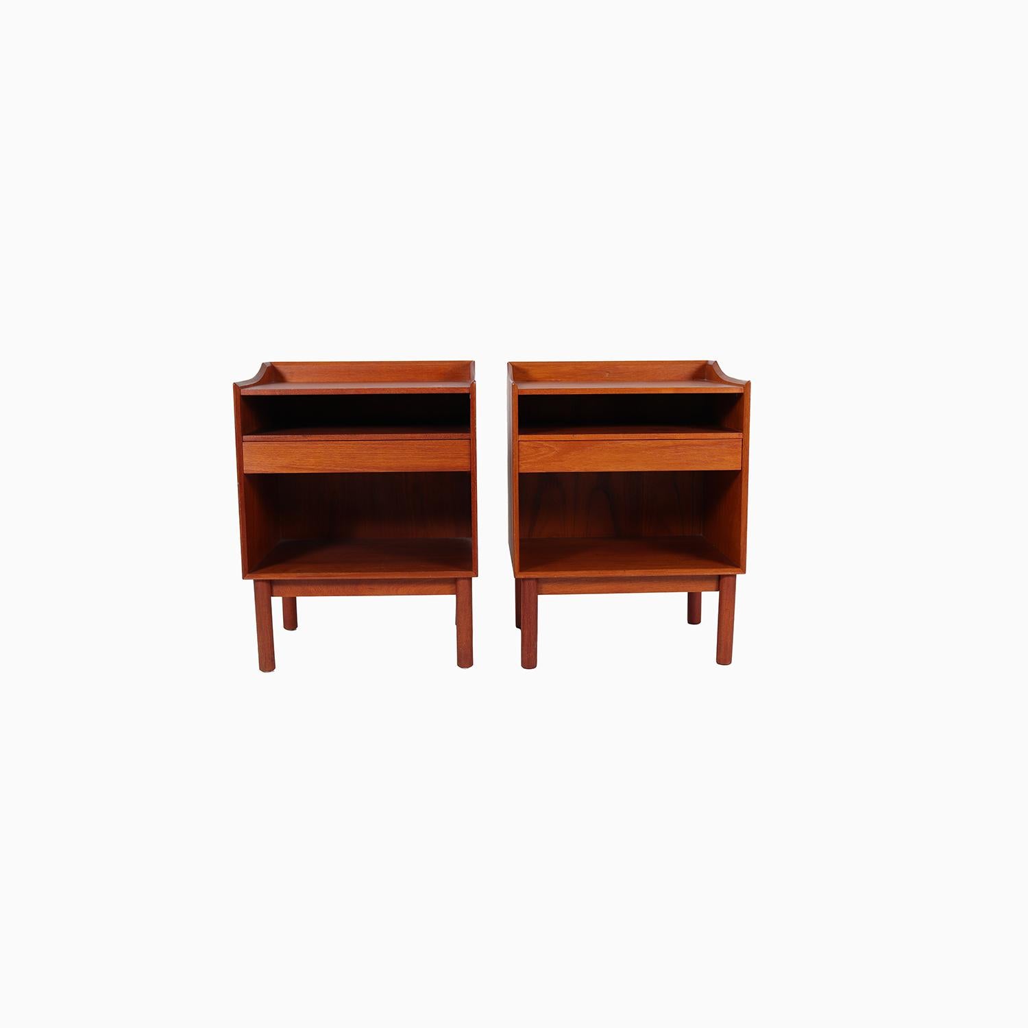 A lovely pair of nightstands designed by Hvidt & Molgaard-Nielsen. Solid teak construction with exposed joinery. A useful design with open storage, single drawer and large space on top. Finished on all sides. 

Professional, skilled furniture