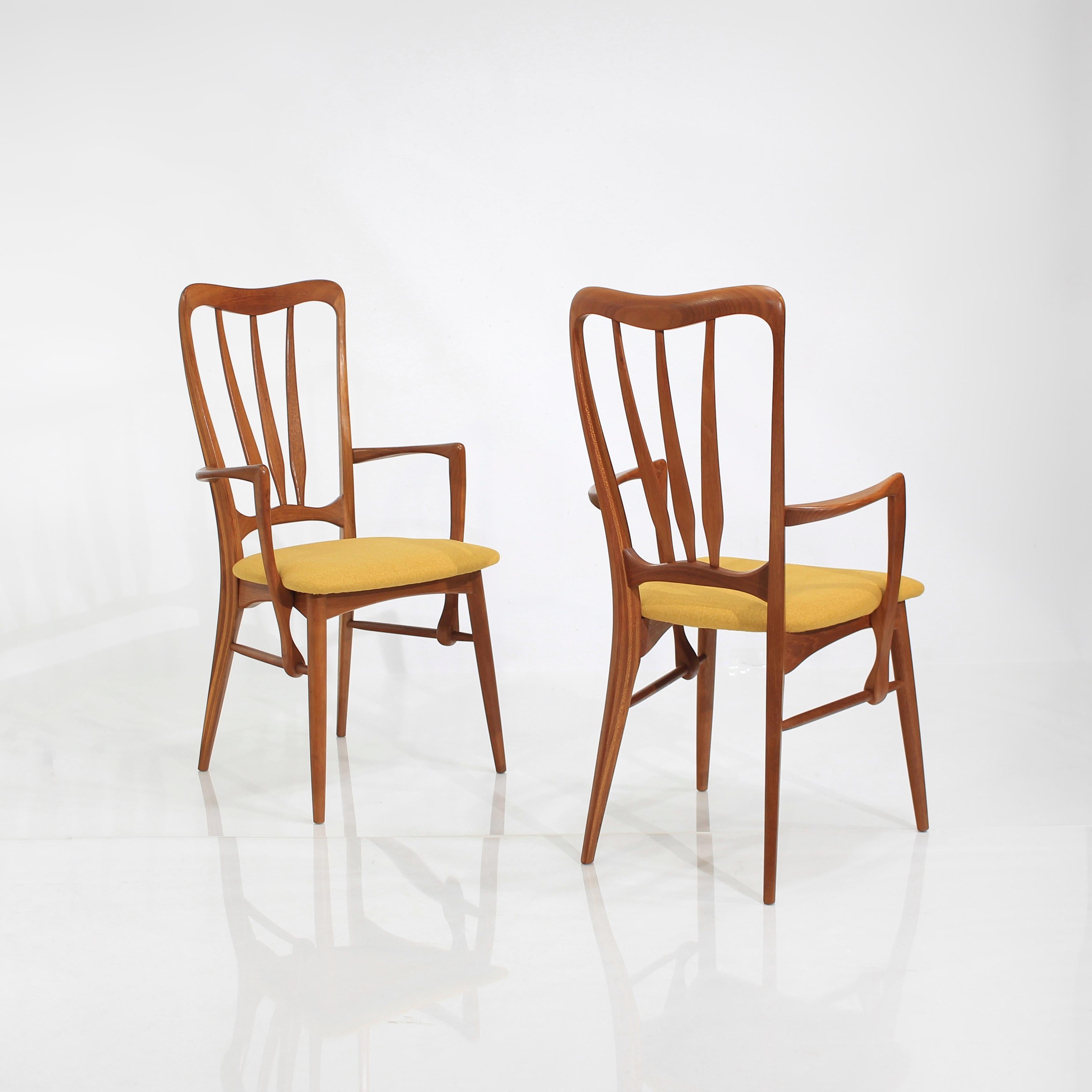 Presenting this stunning pair of Teak ‘Ingrid’ Dining Chair Armchairs by Niels Koefoed for Koefoeds Hornslet.

Displaying captivating lines and contoured support that hugs your back in all the right places.

In Excellent vintage condition.  Frames