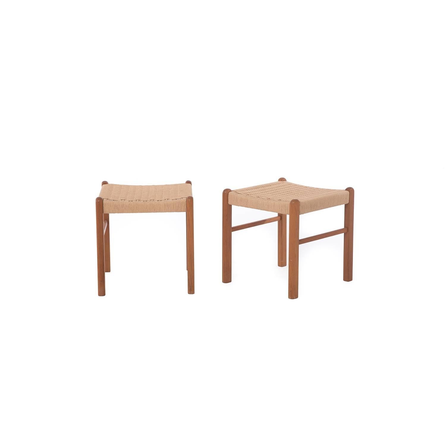 These Danish modern stools by J.L. Møller mix teak with a paper cord seat in an adorable 18 inch cube shape. Sold as a pair.