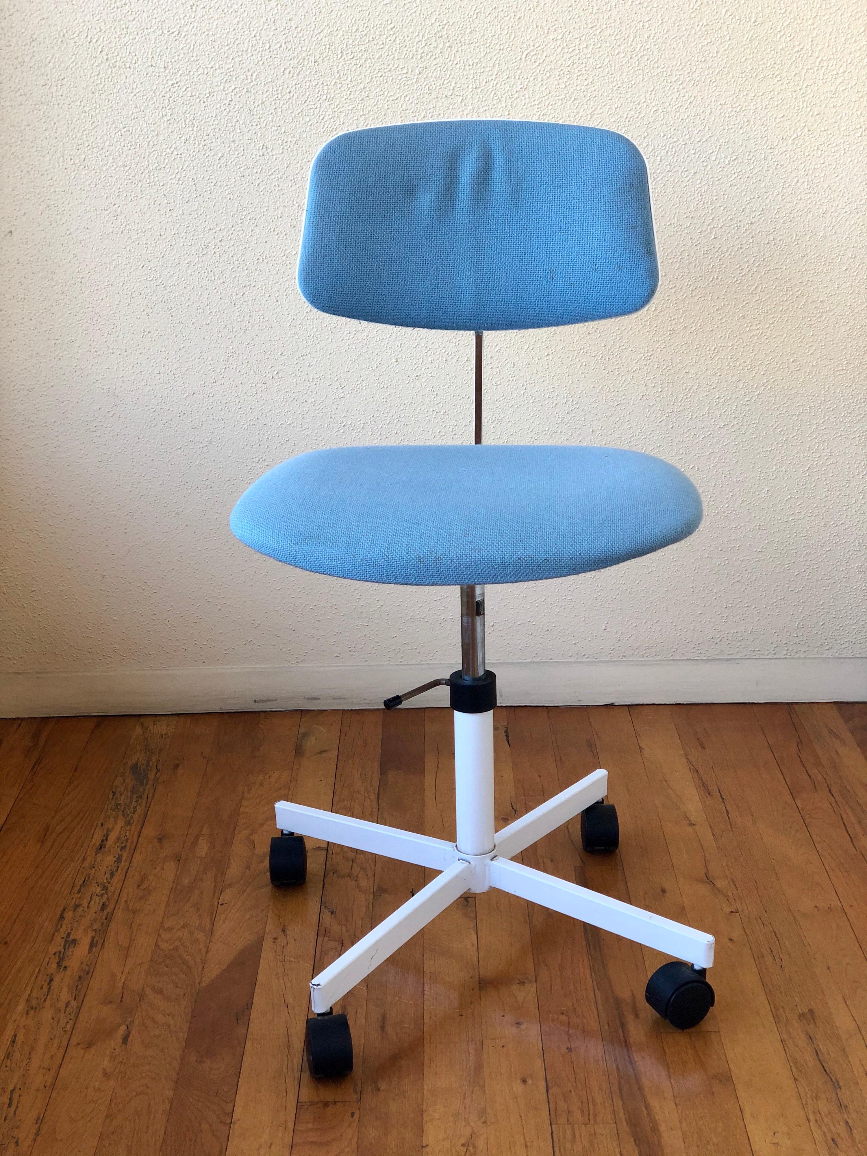 Nice multi-position desk chair with upholstered seat and back, nice baby blue material very clean goes up and down also the back goes up and down.
