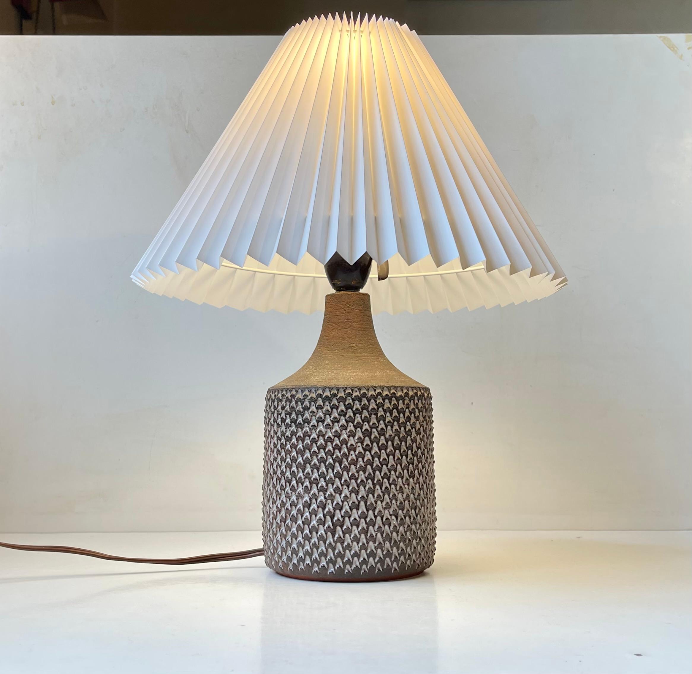 Axel Salto inspired ceramic table lamp by Jytte Trebbien and Harry Nielsen. Micro-buds in brown and white glaze. Its a unique piece made at Tusbo keramik in Denmark circa 1970. It features its original bakelite socket with on/of switch and comes