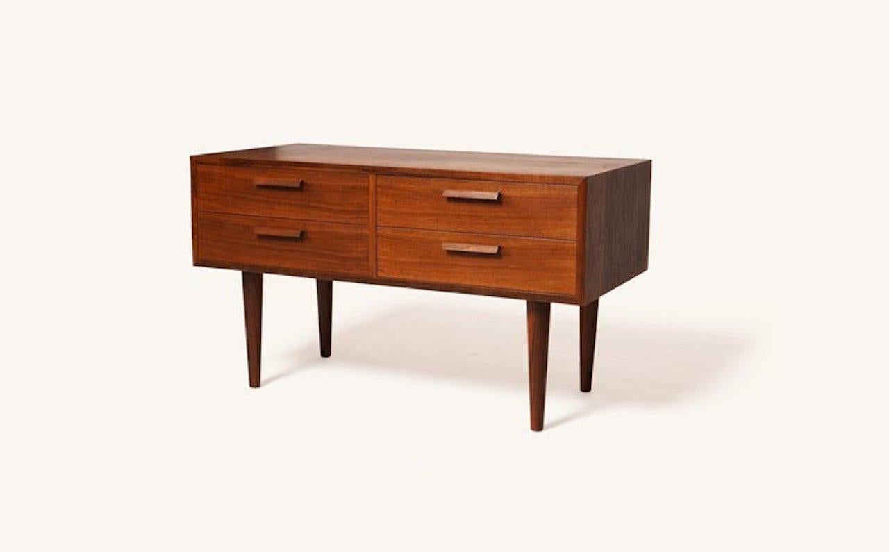 Danish modern Kai Kristiansen for MF Mobler rosewood credenza is a prime example of exceptional craftsmanship shown throughout Kristiansen’s work. A petite credenza with original label ideal for smaller storage of any kind and table top display.

