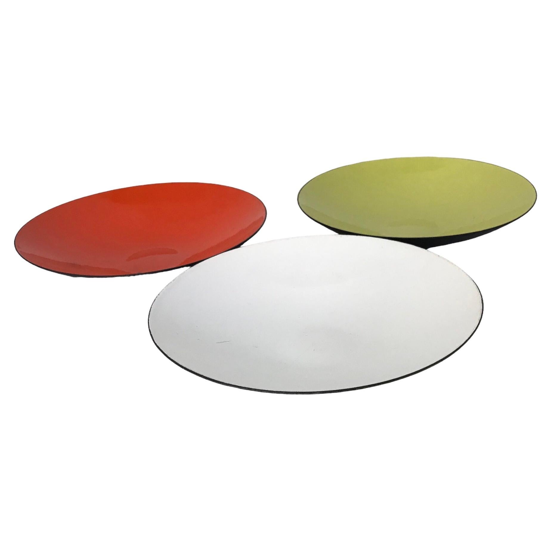 Herbert Krenchel designed rare 1950s vintage set of 3 Krenit flat dishes, 1.25 inches in height by 6.5 inches diameter, marketed by Torben Ørskov of Denmark.  One of each – inside color white, lime green and tomato red outside matte black.
The stamp
