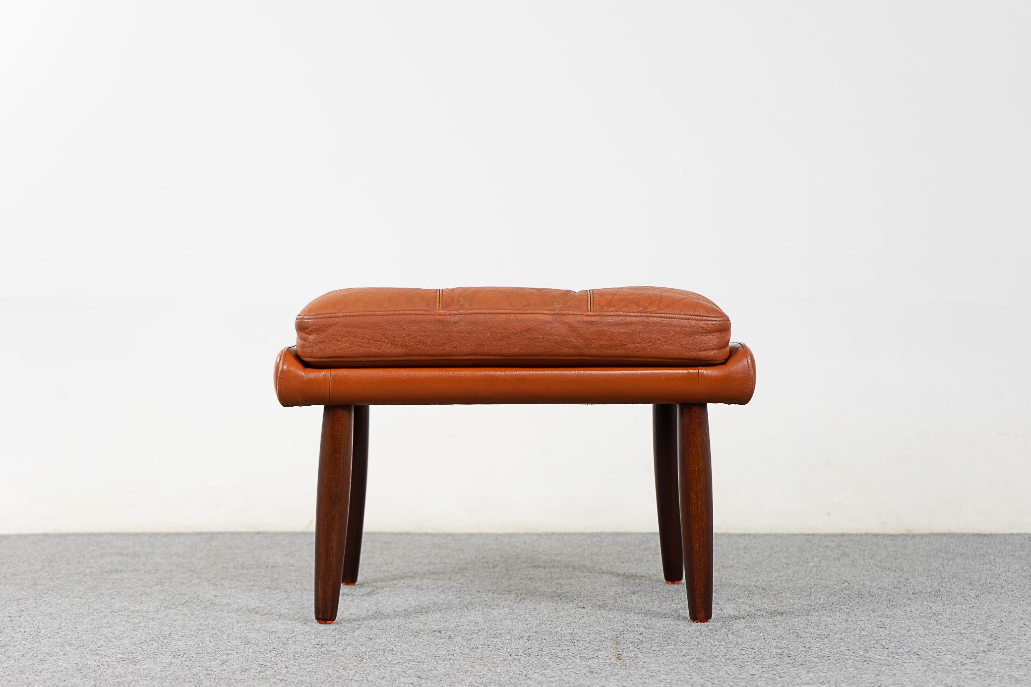Leather & teak footstool, circa 1960's. Original tufted leather in nice condition. Tapering teak sleek legs!

Please inquire for international and remote shipping rates.
