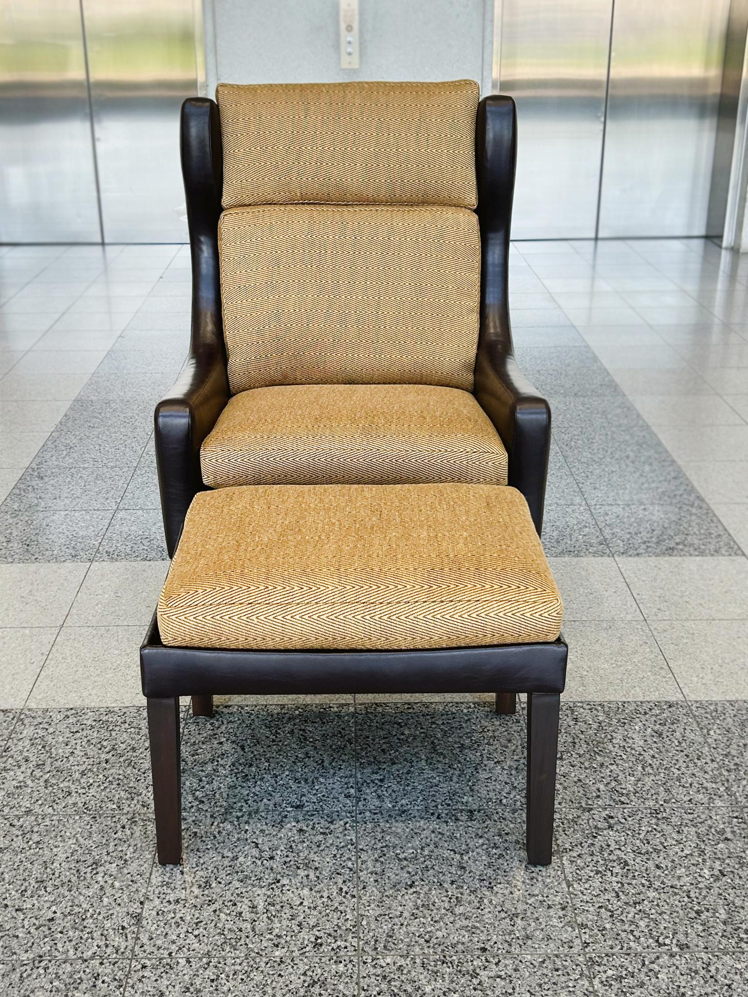 Originally made in the 1960s in the style of Børge Mogensen, this Danish Modern set includes a wingback armchair and an ottoman. Both pieces have been entirely refashioned with chocolate brown leather upholstery. Their new removable cushions are
